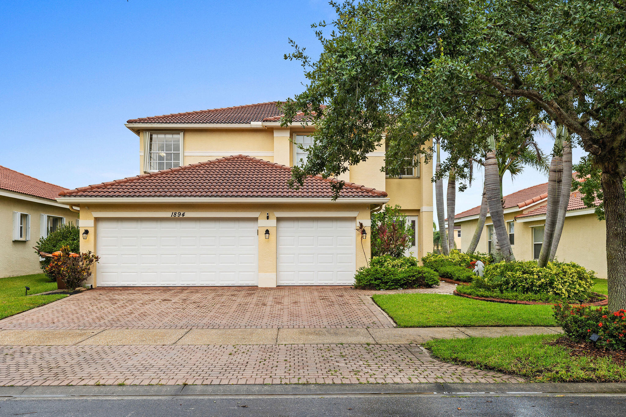 Welcome to Falcon Trace—a sought-after gated community in Vero Beach known for resort-style amenities, low-maintenance living, and prime proximity to beaches, shopping, dining, and top-rated schools. This spacious 2006-built lakefront home offers 5 bedrooms, 3 bathrooms, a 3-car garage, and over 3,000± sq ft of thoughtfully designed living space.  Inside, you'll find an updated kitchen and two beautifully renovated baths featuring shaker-style cabinetry with soft-close doors, upgraded flooring throughout (no carpet), and generous living spaces designed for both everyday comfort and effortless entertaining.  Wake up to peaceful water views from your private primary suite balcony, unwind on the screened lanai, and enjoy added value with a Kinetico water softener system and Rid Rust system.