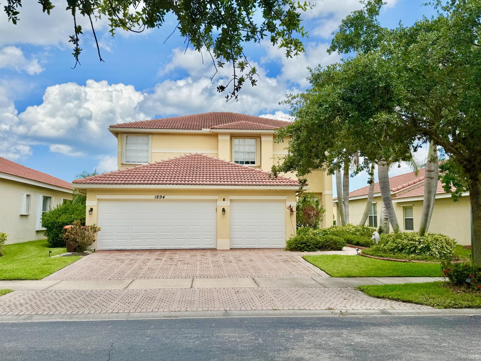 Welcome to Falcon Trace—a sought-after gated community in Vero Beach known for resort-style amenities, low-maintenance living, and prime proximity to beaches, shopping, dining, and top-rated schools. This spacious 2006-built lakefront home offers 5 bedrooms, 3 bathrooms, a 3-car garage, and over 3,000± sq ft of thoughtfully designed living space.  Inside, you'll find an updated kitchen and two beautifully renovated baths featuring shaker-style cabinetry with soft-close doors, upgraded flooring throughout (no carpet), and generous living spaces designed for both everyday comfort and effortless entertaining.  Wake up to peaceful water views from your private primary suite balcony, unwind on the screened lanai, and enjoy added value with a Kinetico water softener system and Rid Rust system.
