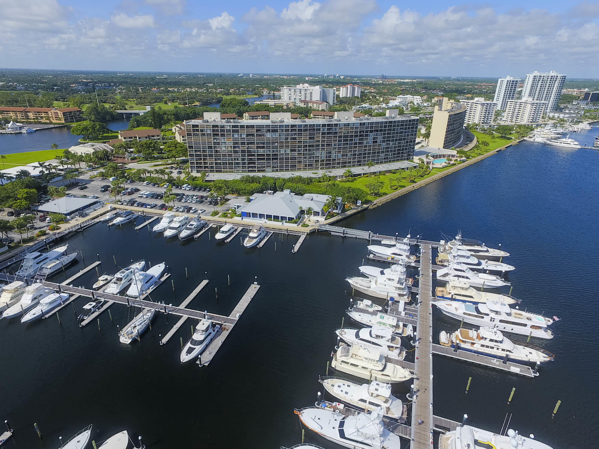 Enjoy spectacular waterfront living in the sought-after Quay building in North Palm Beach, featuring stunning marina views and front-row sights of luxury million-dollar yachts. This beautifully updated and extremely spacious 2-bedroom, 2-bath condo features renovated flooring, kitchen, and bathrooms, including a spa-inspired rain shower, all designed with an elegant Mediterranean feel and timeless style throughout.  Wake up to breathtaking water views from the primary suite, guest bedroom, and family room, while gentle marina breezes flow through the spacious covered patio overlooking the sparkling blue water and marina. Convenient elevator access makes this residence both comfortable and accessible. Located in prestigious Old Port Cove, this residence is one of the best deals currently available in the community and offers the perfect blend of waterfront luxury and Mediterranean-inspired charm. Florida living at its finest.