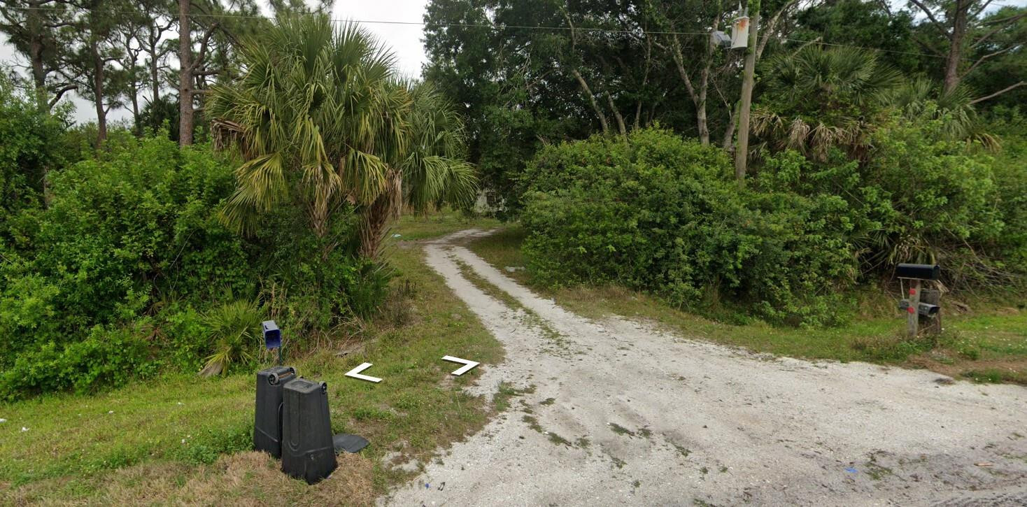 Vacant Industrial 3.43 acres which includes Power Poles, Septic, Structure, Survey, and Well Water. Old structures on the property. Owner financing available