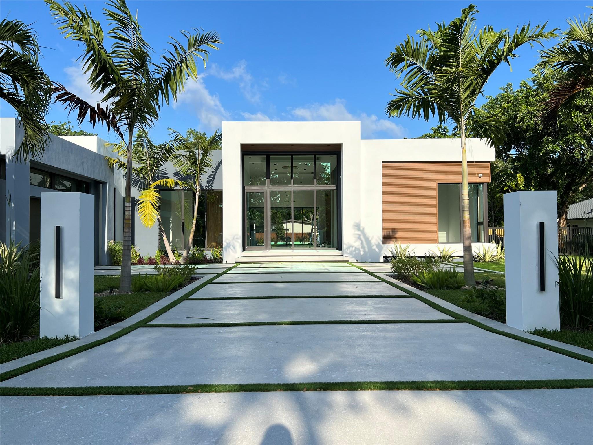 Luxurious New construction Masterpiece. This house's unique design and modern finishes are sure to impress! Ravishingly sophisticated Design, expansive open floor plan, seamless Indoor Outdoor living spaces perfect for entertaining, 16 foot ceilings, natural light filters through large floor to ceiling impact glass, Chef's Kitchen with Luxury appliances and floor to ceiling custom wood cabinetry, professional grade range, built-in Coffee maker, oversized Quartzite Natural stone waterfall island, Butlers Pantry. Master Suite with Study/ Workout area overlooking the pool, spa like Master bath with a trough sink, generous his and hers closets, dream Laundry/ Mud room with floor to ceiling built ins, Pet Wash Station, large pool with sun deck, lush landscape.Best value in new construction!