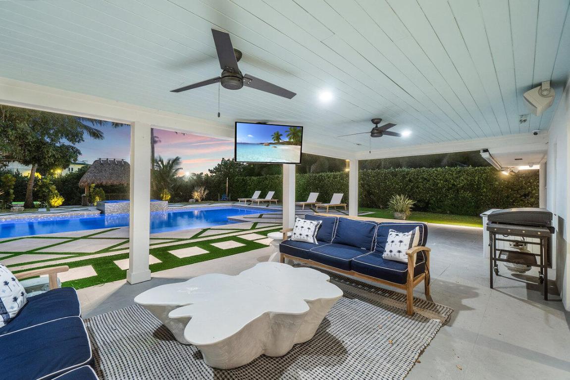 Experience luxury waterfront living in one of the best locations in North Palm Beach! This exquisite, fully remodeled home is situated on a prime, over half-acre lot with 130' of frontage on the serene River. 

Step into a light-filled Great Room with elegant porcelain floors. The custom kitchen boasts stainless steel appliances, granite and quartz countertops, a pot filler, a farmhouse sink, a large center island with under-counter storage, and a wine cooler.

The spacious master bedroom features two walk-in closets with built-ins and a stunning open bath with a frameless glass shower and rain-head. Additionally, there is a large bonus room/den perfect for a home office or extra living space.

The expansive backyard is an entertainer's dream with a brand new, state-of-the-art