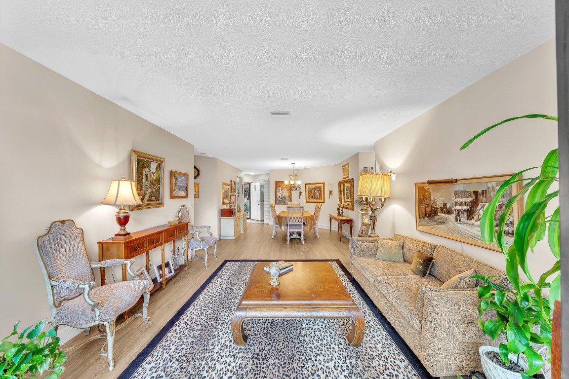 Exceptionally well-priced, spacious condo with a spectacular lake view from living room and each bedroom. Spilt bedroom layout, large walk-in closet, renovated floors, open and bright with an enclosed patio. Full size washer and dryer, air conditioning unit replaced in late 2020. Exterior: newer roof, freshly painted building with ample parking. VA loans qualify. Association requires 10% down.Residents get to enjoy a beautiful heated pool. As well as full access to Township amenities which include a gym, olympic sized pool, spa, clubhouse, a movie theater, a library, tennis and basketball courts and shuffle board.Maintenance fee provides: cable, internet, water, trash, sewer, pest control, exterior insurance, landscaping and roof repairs. Designated parking also included with unit.