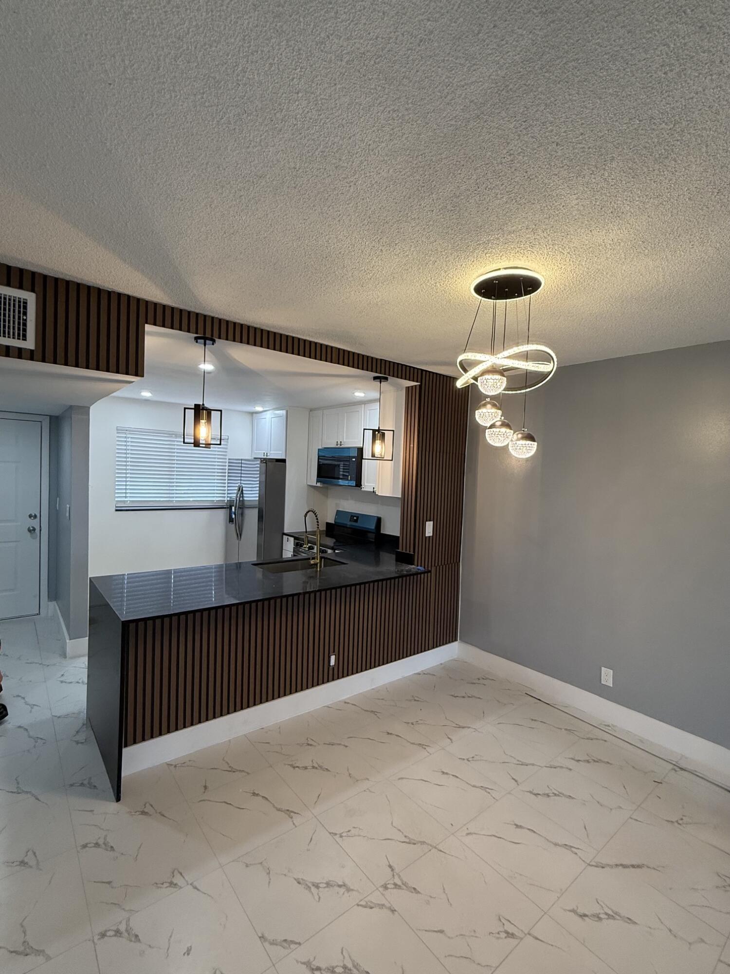 ~Totally Remodeled~ Everything is brand new! This 1 bedroom, 1 and half bath has been tastefully designed with modern finishes. Recessed lighting, contemporary LED light fixtures, new 18x18 Calacatta tile throughout. New kitchen boasts new cabinets, new granite countertops, SS appliances, newer A/C, new water heater, new baths! Enjoy the waterview from your sunporch, windows are all hurricane impact. Laundry and storage on floor, elevator, resort style living and amenities! Call today to preview, this will go fast. 55+ only