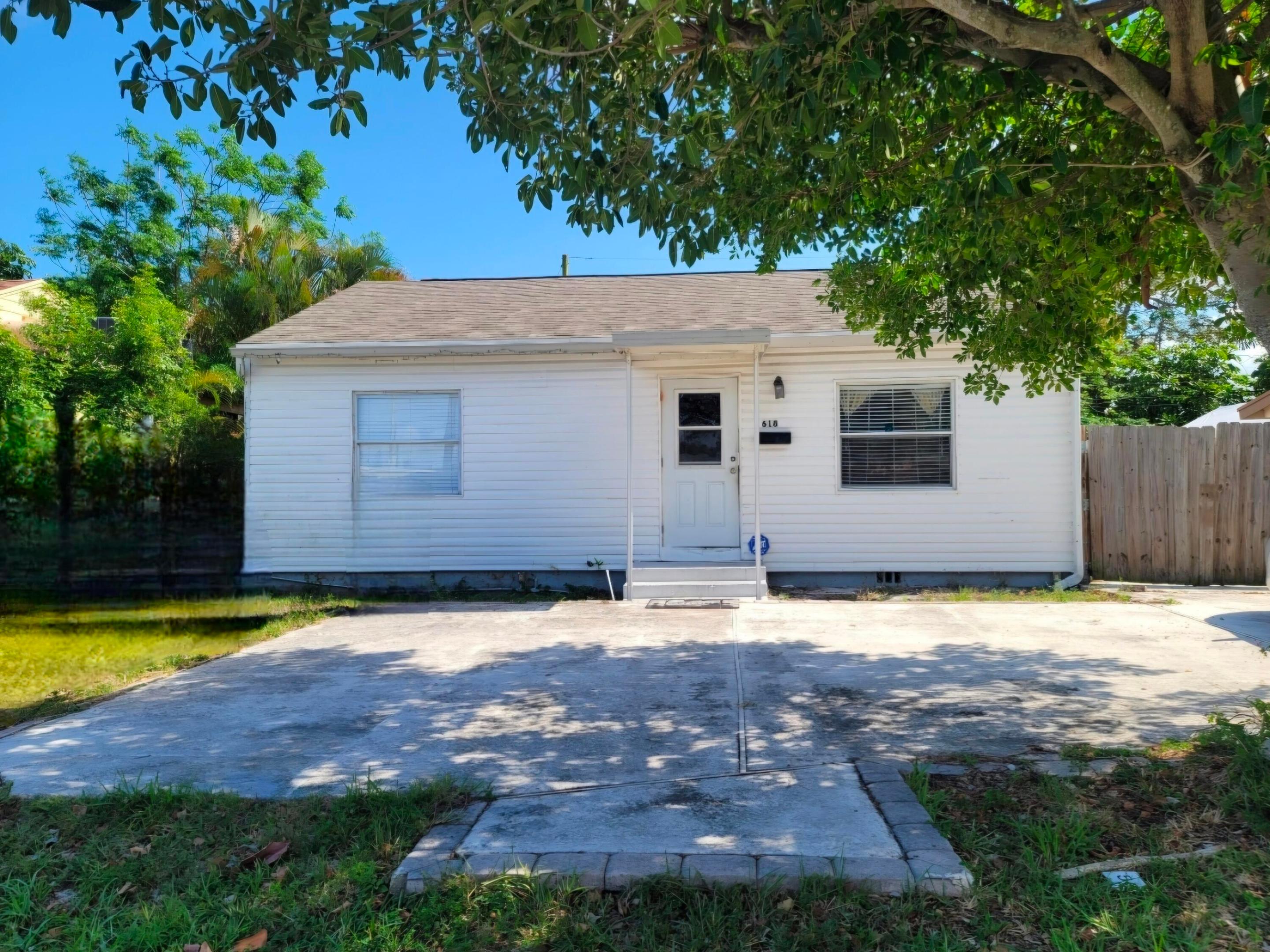 Located in the highly sought-after SoSo area of West Palm Beach, this charming 2 bedroom, 1 bath home offers great flexibility as a primary residence, second home, or investment opportunity. Features include an upgraded kitchen and bathroom, plus a spacious covered and screened patio overlooking a fully fenced backyard; perfect for relaxing or entertaining. Roof is only 10 years old. Currently operating as a successful Airbnb, this property may be purchased furnished for a turnkey opportunity or personalized to make it your own. Conveniently located near dining, shopping, downtown West Palm Beach, and just 3 miles to the beach and 4.5 miles to West Palm Beach International Airport. Welcome to your Blue Jewel Home!