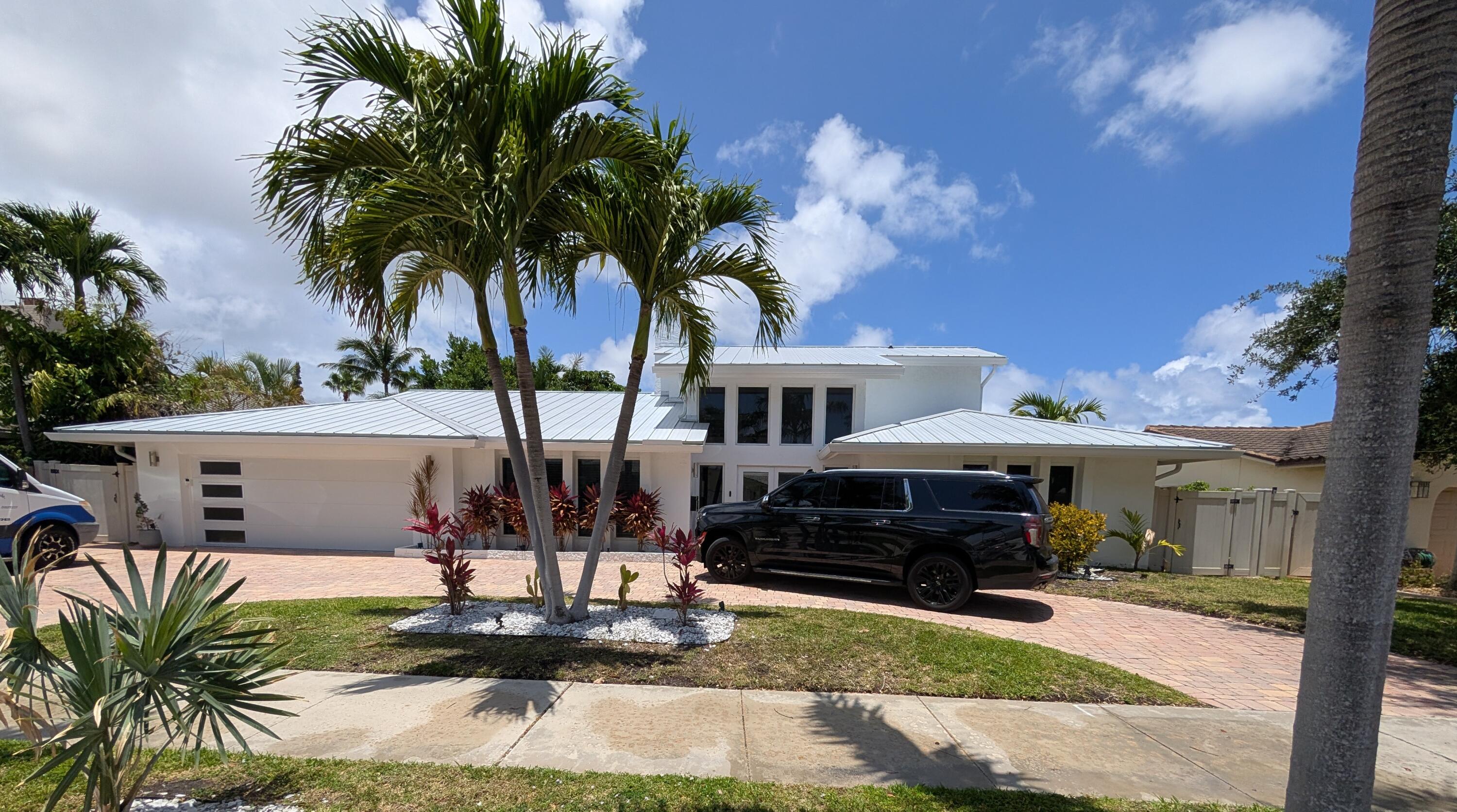 **Tropical Paradise in The Cove: The Ultimate Waterfront Lifestyle** Welcome to your dream waterfront oasis in the highly sought-after Cove neighborhood. This spectacular 4-bedroom, 3-bathroom pool home perfectly blends sophisticated indoor living with an unparalleled outdoor paradise. Designed for ultimate privacy and effortless entertaining, the backyard features a pristine pool wrapped in lush landscaping and a magnificent, custom tiki hut that brings resort-style living right to your doorstep. Whether hosting dynamic gatherings or enjoying quiet water views, this private sanctuary offers the absolute best of South Florida living.