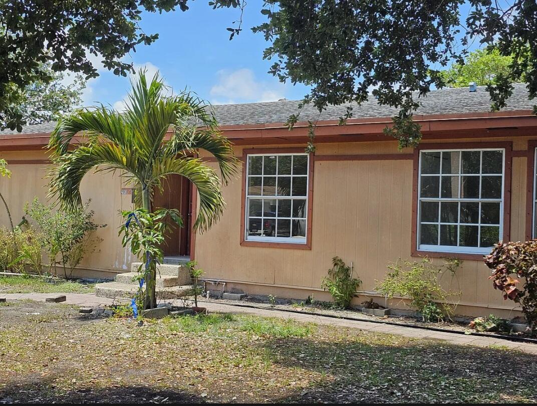 Spacious 4-bedroom, 2-bath split-bedroom apartment filled with natural light. The open living area offers the perfect blend of comfort and functionality, making it ideal for your family's needs. Enjoy the privacy of your own front and back yards, perfect for relaxing or entertaining. The fully fenced property provides plenty of secure on-site parking, and a washer and dryer are conveniently located inside the unit. Conveniently located near Downtown West Palm Beach, PBI Airport, parks, shopping, dining, and I-95, offering easy access to everything you need.