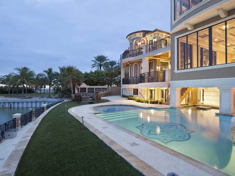 Fronting the Hillsboro Inlet with 100± feet of deepwater shoreline plus another 127± feet of sandy beachfront, this 3-story majestic Mediterranean Revival estate looks across to the historic Hillsboro Lighthouse and out to the Atlantic waters. The stunnin g resort-style outdoor entertainment area provides a loggia by the mosaic-inlaid pool featuring a spillover spa, fire-pits, sun shelf, swim-up bar and summer kitchen. The property is complete with multi-boat dockage right by the entrance to the ocean.