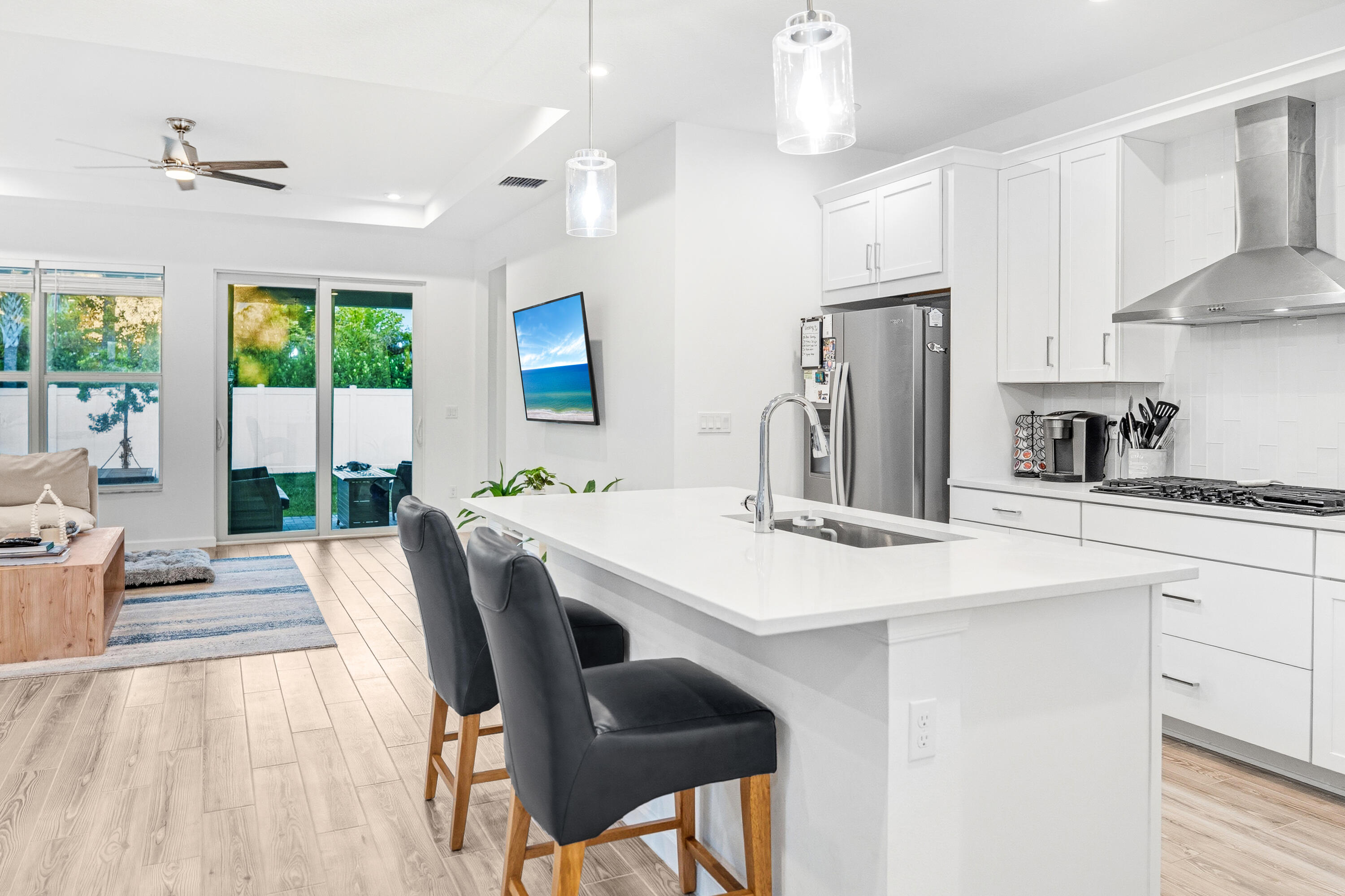 Motivated Seller. Like-new 2022 home in Tradition. 2 Bed + Flex Room That Can Be Used as a 3rd Bedroom!     This stunning 2-bedroom, 2-bathroom home with flex room offers the perfect blend of comfort and luxury in the highly desirable Emery neighborhood of Tradition. This Aspen model by Mattamy Homes features ALL available luxury upgrades.  Step inside to discover vaulted ceilings throughout the living areas and primary bedroom.  The gourmet kitchen showcases elegant white shaker cabinets with quartz countertops, stainless steel appliances including a gas stovetop, built-in oven, microwave, dishwasher, and refrigerator. You'll love the walk-in pantry and convenient storage options throughout. The spacious primary bedroom includes an oversized walk-in closet and connects to a luxurious bathroom featuring a walk-in spa shower with upgraded fixtures. Both bathrooms boast beautiful quartz countertops and premium Moen fixtures. Additional features include a versatile bonus room perfect for an office, nursery, or third bedroom, hurricane-resistant glass windows allowing abundant natural light, smart home thermostat, and EV charging wiring. The home comes complete with top-of-the-line LG washer and dryer. Outside, enjoy your private fenced backyard with paver patio, perfect for entertaining. The home's location is just 5 minutes from downtown, steps away from the NEW Tradition park, top schools, and offers access to the community tram system.