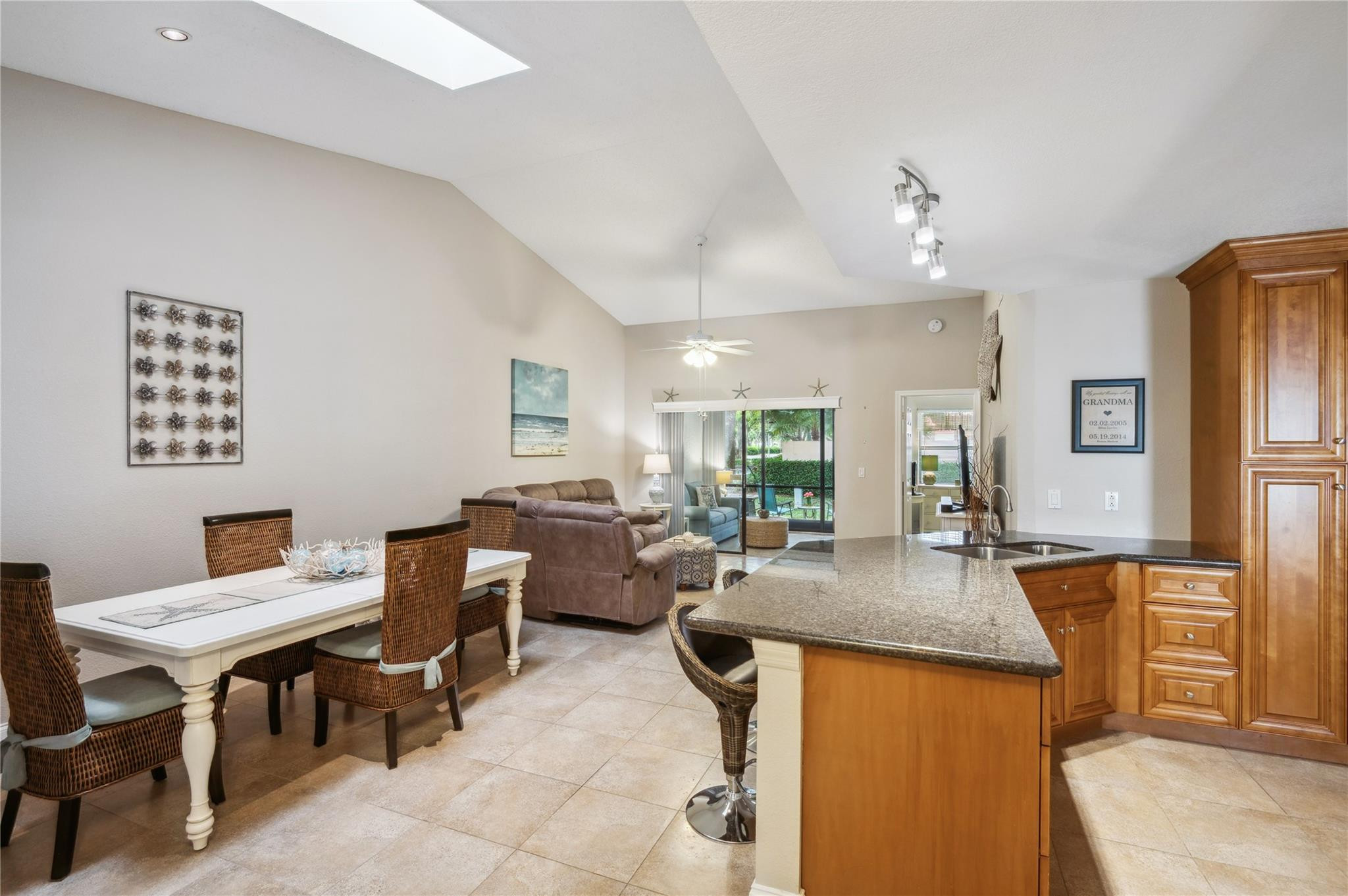 This beautifully updated villa-style home features an open, updated kitchen, impact windows, new bedroom floors. Situated just across from a secluded community pool, the convenience of shared amenities with the feel of a private retreat. Spacious walk-in closet offers great storage, guest bathroom is designed to accommodate guests. The enclosed, air-conditioned balcony adds extra living space, ideal for entertaining or relaxation. Enjoy your designated parking spot, pets welcome! Located in a gated, manned community with stunning lake views, amenities include a pool, gym, tennis, bocce, and basketball courts. Perfect as a full-time residence or vacation property. 1 mile from a park with scenic trails, minutes from I-95 for easy commuting. Experience comfort, security, and convenience.