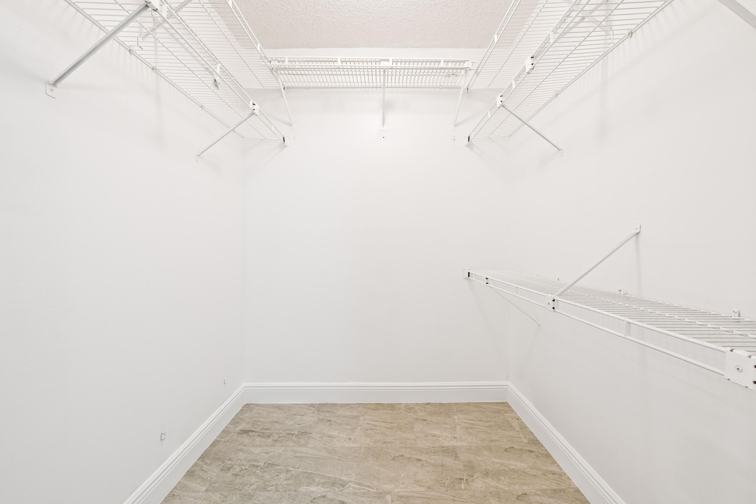 Great "F" model 3 bedrooms and 2 1/2 bathrooms. Remodeled kitchen, new kitchen appliances, 3 year old AC, new water heater, laminate wood floors, some windows are impact windows, the rest have shutters. Building is across the street from community pool. Near The Pomp, shops, restaurants, beaches and main highways.