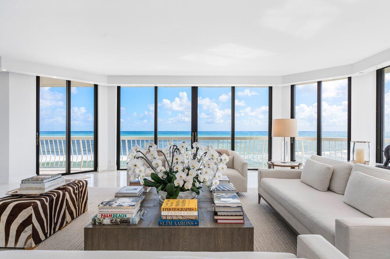 ''The world is your oyster.''  This rare, stunning, high floor, fully renovated, Southeast corner residence with unobstructed panoramic views is a  prized jewel of the prestigious Sloan's Curve 2100 Building. The home exudes sophistication, serenity and quality. The elegant, light-filled corner unit has 3 Bedrooms + Den & 3.5 bath home with incomparable views of the Atlantic ocean, Phipps Ocean Park and the Intracoastal waterway.  Experience morning sunrises over the ocean and evening sunsets over the Intracoastal with sunlight throughout the day. This  unit offers an uncommon opportunity to experience the best of Palm Beach oceanfront turn-key living. The interior renovation includes Dolomiti marble flooring, Calcutta marble vanities and top of the line fixtures.  Floor to ceiling impact glass doors compliment the 3200+ interior that is surrounded by a wrap around balcony for an Alfresco Palm Beach lifestyle.  Other features include a recently renovated air conditioned poolside cabana with bathroom, 2 parking spaces and additional storage. 
The 2100 Building offers superb Management & Services. It has a 24 Hour Manned Gatehouse, 24/7 Doormen Security, 6 Har-Tru Tennis Courts & Pro-Shop, a newly equipped Fitness Center,  75' Heated Swimming Pool & Hot Tub & Poolside BBQ Summer Kitchen. This sensational property is meant to be celebrated and appreciated by its owners and guests. It truly is one of the finest oceanfront residences available in years on Palm Beach Island.