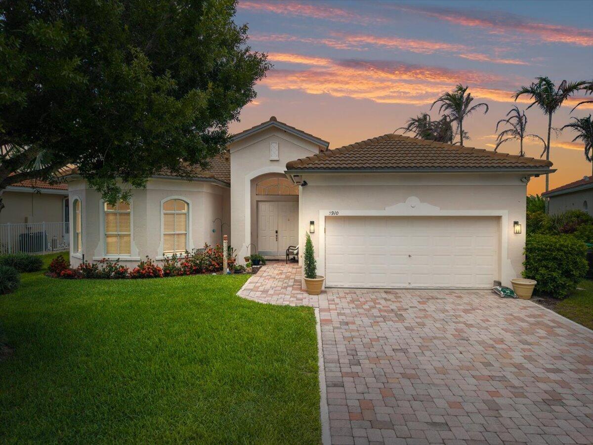 Welcome to easy, low-maintenance Florida living in the sought-after gated community of Portofino Shores, where resort-style amenities, scenic surroundings, and everyday convenience come together to create the lifestyle so many buyers are searching for. Perfect for year-round residents, seasonal homeowners, or anyone looking to enjoy the Treasure Coast, this beautifully maintained lakefront home offers comfort, privacy, and peace of mind with numerous recent updates already completed. Inside, the thoughtfully designed floor plan features an updated kitchen with modern cabinetry and finishes, granite-wrapped countertops, complemented by new stainless steel range, dishwasher, and microwave installed in 2025. The guest bathroom has also been tastefully renovated, while wood flooring in the primary bedroom and wood-look laminate throughout the main living areas create a warm, cohesive feel. Fresh interior paint, updated lighting, and ceiling fans add to the home's bright, move-in-ready appeal.  One of the home's standout features is the spacious 20' x 15' enclosed patio overlooking a peaceful lake, providing the perfect setting for morning coffee, evening sunsets, or entertaining friends while enjoying Florida's year-round climate.  Major improvements—including a 2021 roof, 2018 HVAC system, and 2020 water heater—offer added confidence and reduce future maintenance concerns.  Beyond your front door, Portofino Shores provides a true resort-style lifestyle with a manned gated entrance, elegant clubhouse, fitness center, sparkling community pool, tennis courts, and volleyball courts. When adventure calls, you're just minutes from Fort Pierce Inlet State Park, Pepper Park Beach, the Savannas Recreation Area, and the vibrant waterfront district of Downtown Fort Pierce, where you'll enjoy local restaurants, marinas, boutique shopping, live entertainment, and the historic Sunrise Theatre. Whether you're spending the day at the beach, kayaking through natural preserves, or enjoying dinner overlooking the water, this location places the very best of Florida's Treasure Coast within easy reach.