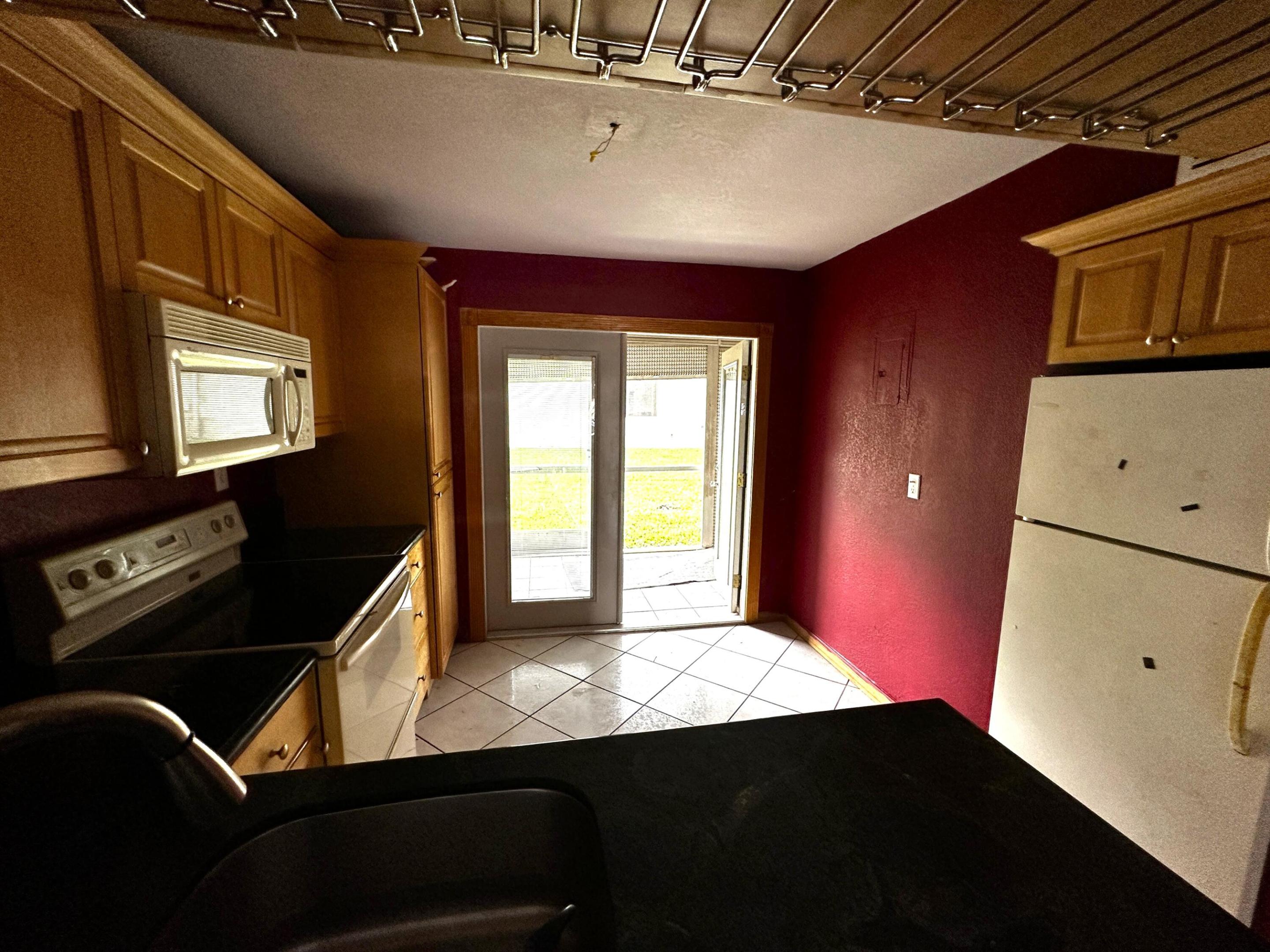 Rare opportunity! The best-priced 2-bedroom condo in Davie is ready for your vision. Located in a desirable two-story, low-rise community, this first-floor 2-bedroom, 1.5-bath condo offers a fantastic opportunity to renovate and make it your own while adding value along the way. The functional floor plan features a spacious living and dining area, a private rear patio with washer & dryer hookups, additional storage space, and one assigned parking space. Enjoy the amenities of this well-maintained community, including a clubhouse, swimming pool, and event/meeting room. The association fee includes building insurance, water, and trash services, providing excellent value. Pets are welcome, subject to association restrictions. Whether you're a first-time buyer looking to personalize your home or an investor seeking immediate rental income, this property is rentable right away with no waiting period. Renovate it to your own taste and enjoy the added value that thoughtful improvements can bring. Ideally located in a quiet, well-maintained community just minutes from University Drive, schools, shopping centers, restaurants, entertainment, public transportation, and major highways, providing easy access to everything South Florida has to offer.