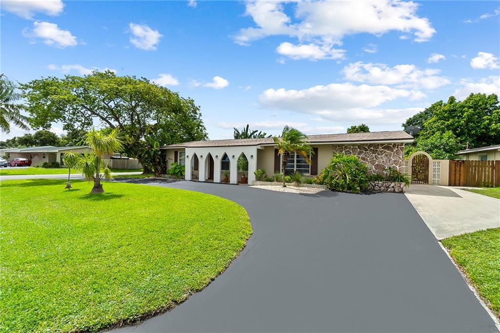Exceptional 3/2 Home in Hollywood, Centrally Located to Schools, Turnpike, Main Highways. Salt Water 'Diamond Brite' Pool, Privacy Fence, Tropical Landscaping, Large Backyard Offers Great Space to Enjoy 'Florida' Lifestyle (Swimming, Barbecue, Lounging etc.) Outdoor Pool Privacy Shower. Updated Bathrooms, Super Curb Appeal with Circular Drive. Covered Entry. Terrazzo and Bamboo Floors Throughout! Very Clean and Ready for New Owner...It Could be You!