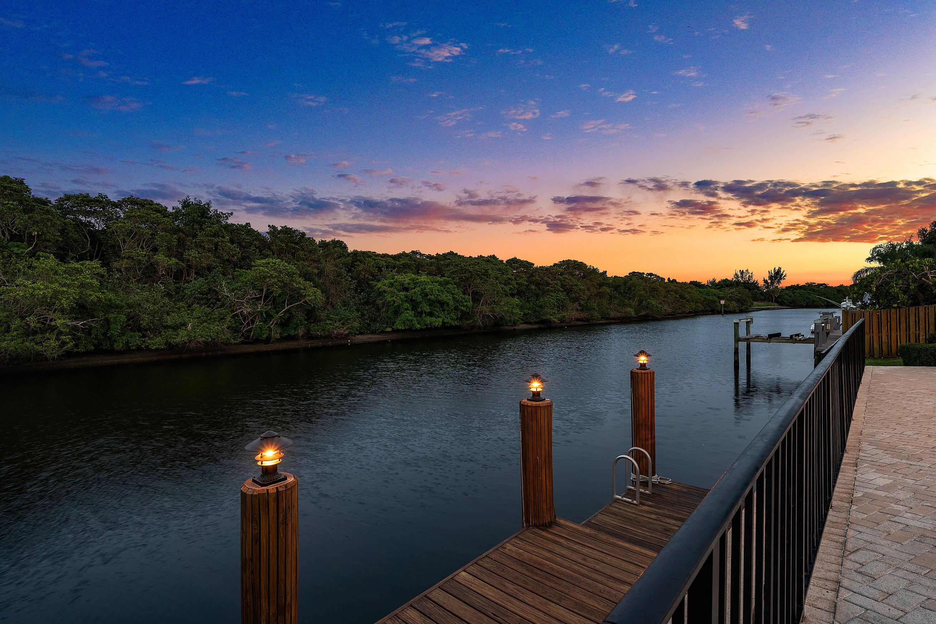 Rarely do you find a sanctuary that balances "boater's paradise" with total backyard privacy, but this Camino Lakes gem delivers both. Perched on a premier lot with 113' of water frontage, the view is a serene expanse of lush mangroves, not a neighbor's patio. Equipped with a 13k lb boat lift on a wide 120' canal, it offers seamless navigation and easy docking. The 4-bedroom home spans 3,100+ sq. ft. of light-filled living space with volume ceilings, open concept, and water views from nearly every room. Whether you're hosting a sunset dinner overlooking the mangroves or heading out to the Inlet, this home captures the quintessential Boca Raton lifestyle, offering total privacy just minutes from downtown Boca, the beach, and top-rated schools. The home has been meticulously updated for the modern buyer: 2024: A complete, spa-inspired Primary Suite bathroom remodel. 2022: A chef's kitchen overhaul featuring new appliances, plus a new Cabana bath and Jack-and-Jill bath. New Shaw luxury vinyl planking throughout for a seamless, coastal-chic aesthetic. PGT Impact Windows and a 2018 roof, the heavy lifting is already done. Water Heater (2021), dual AC units (2019/2021). Located in a coveted Camino Lakes neighborhood zoned for A-rated schools and walking distance to El Rio park featuring pickleball, tennis, basketball, playground, walking paths, BBQ grill pavilions and a kayak launching platform. A rare offering!