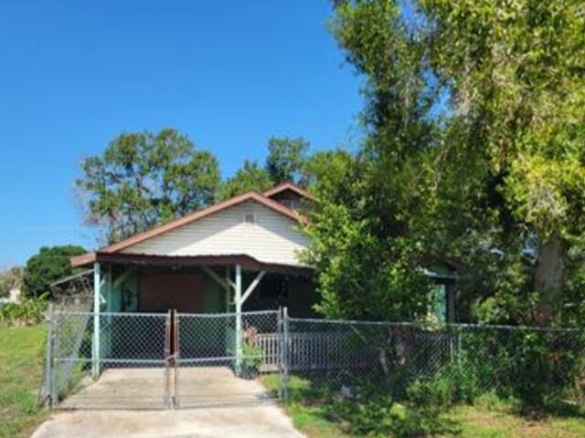 AUCTION. This unique fixer upper will require your renovation ideas. The ranch home features 3 beds, 2  baths, living room, and a kitchen with dining area. Home sits on a spacious lot with a covered patio for all  your outdoor activities. The attached carport offers room for parking. A lot will be needed to restore this  gem but well worth the effort. Property is sold as is with NO property disclosure or inspection report. Make  this one your next project.