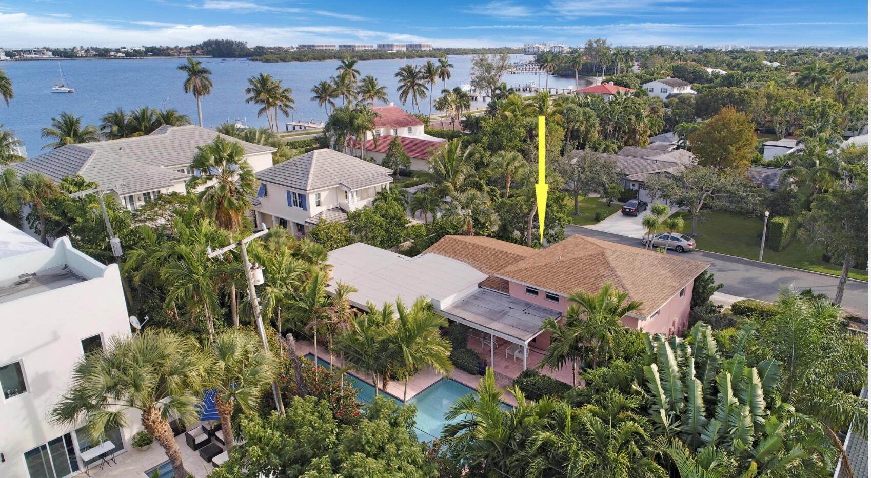 SUPERB LOCATION! 2nd home off Flagler Dr., from IntraCoastal Waterway, offering ELEVATED LOT, surrounded by Luxury Homes, & within A+ School Districts! Beautiful 3 bedroom 3 Bath POOL HOME with Den for all your family needs! Fantastic Open Floor Plan with loads of Natural light! Mexican Tile and Hardwood Floors compliment this Freshly Painted Split Level Home. Enjoy dinner in the Screened Lanai, off of the Fireplaced Living Room or Dine Al Fresco under the covered Patio overlooking Pool! Outdoor Living at its BEST, with extended Brick Patio for Sun Bathing and PRIVATE Expansive Pool Area! Build your DREAM HOME in this coveted location, or enjoy home in present condition.