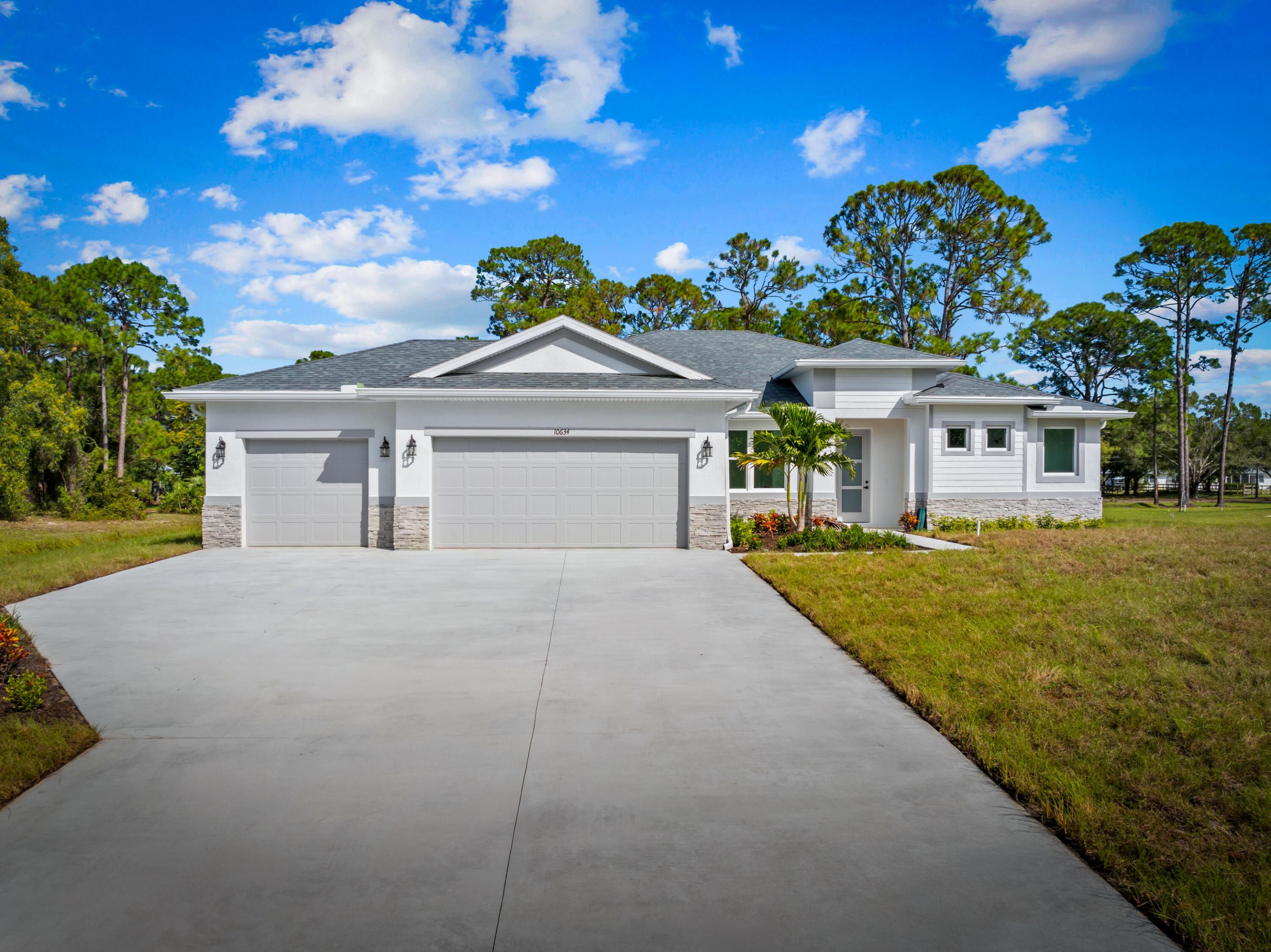 This 4 bedroom, 3 bath, 3 car garage custom home sits on over an acre and is absolutely loaded with upgrades.  This home features an upgraded kitchen with 42" white shaker cabinets and small glass cabinets above to the ceiling.  This kitchen has Calacatta Quartz countertops with a calacatta quartz backsplash.  This kitchen includes a stainless steel range hood and an enormous island with a waterfall edge.This custom new construction home also includes tongue and groove ceilings on the front and back porches and stacked stone on the front exterior, 8 foot custom doors and 1x look oversized baseboard and casing.  The great room has a coffered ceiling with crown molding.  The home also includes oversized plank tile throughout the home (no carpet) and a possible outdoor kitchen, ETC!