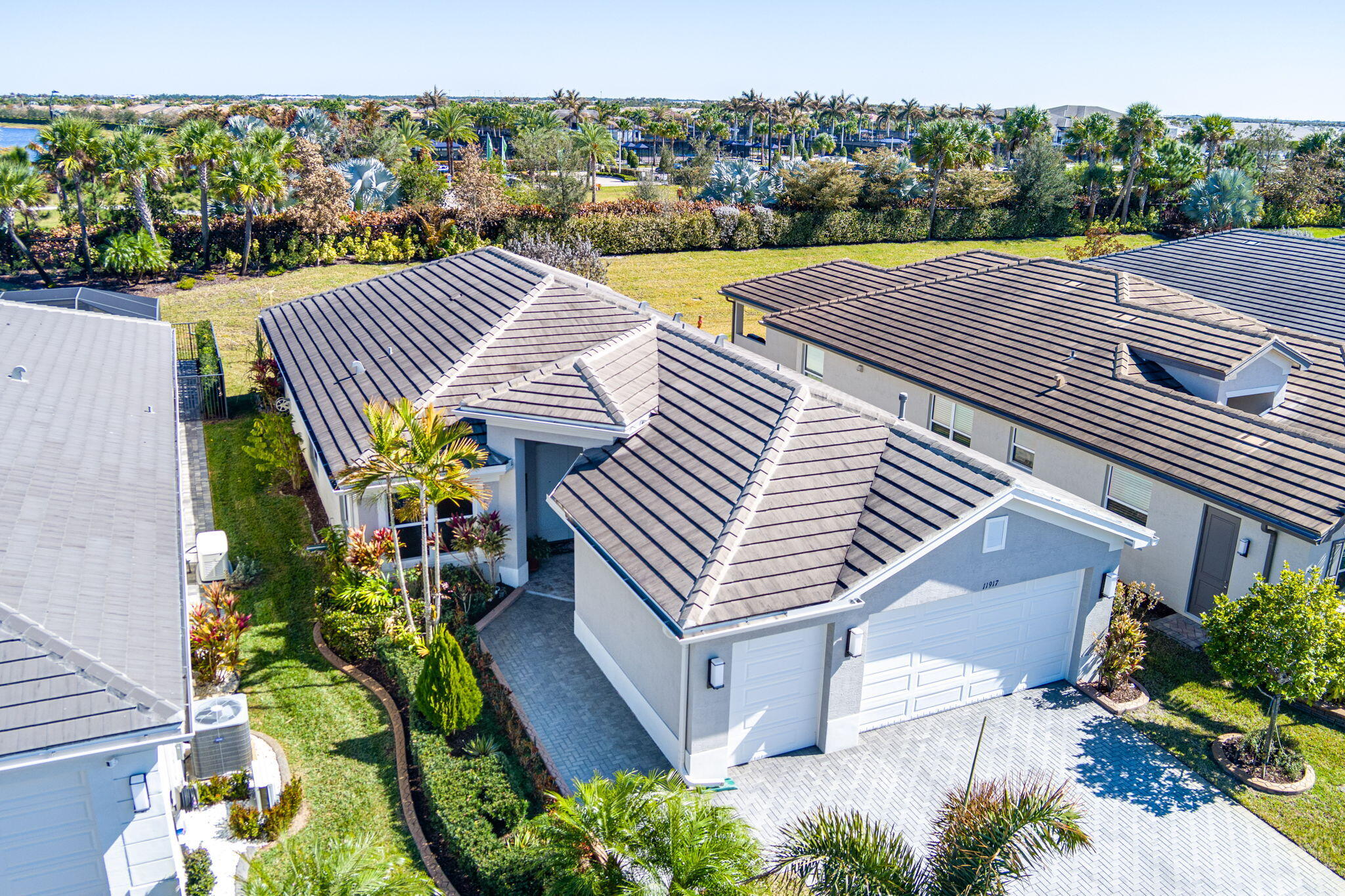 Welcome to this beautifully upgraded Palazzo model in the highly sought-after Riverland 55+ community. Offering nearly $50,000 in enhancements, this spacious residence features 3 bedrooms, 2.5 baths, plus a versatile office/den. The open-concept design is perfect for both everyday living and entertaining, highlighted by an upgraded galley kitchen with abundant cabinetry, a large center island, gas range, breakfast nook, and formal dining area. The private primary suite offers custom built-in closets and a luxurious bath with dual vanities, a walk-in shower, and private water closet. Additional upgrades include impact glass windows, Hunter Douglas custom shades, crown molding, upgraded tile in the entry, patio and garage, and a large screened, custom-tiled lanai  overlooking a premium berm-backed lot for added privacy. Enjoy resort-style living with Riverland's world-class amenities, including clubhouses, fitness centers, pools, pickleball and tennis courts, walking trails, social activities, and more. HOA includes Xfinity cable, pest control, trash service, and access to all community amenities.