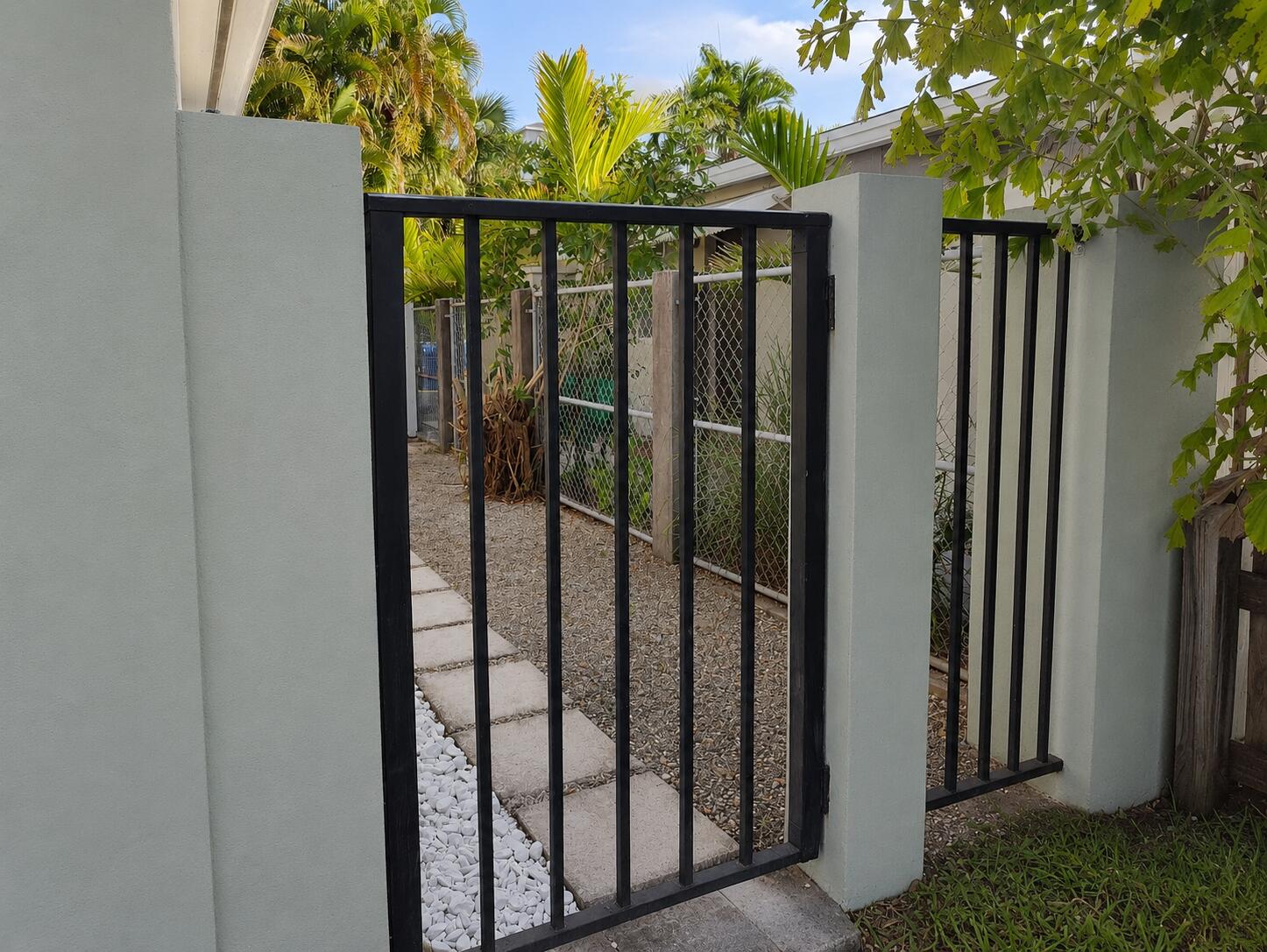 Clean and freshly painted hotel-style unit featuring a refrigerator and a full bathroom with a tub/shower combination. Enjoy a private outdoor patio and the convenience of a separate side entrance for added privacy. Rent includes wifi, water, electricity, and trash service. Conveniently located near Publix, Holiday Park, and just minutes from the beach, with easy access to shopping, dining, and recreation. A comfortable, move-in-ready rental in a great location.
