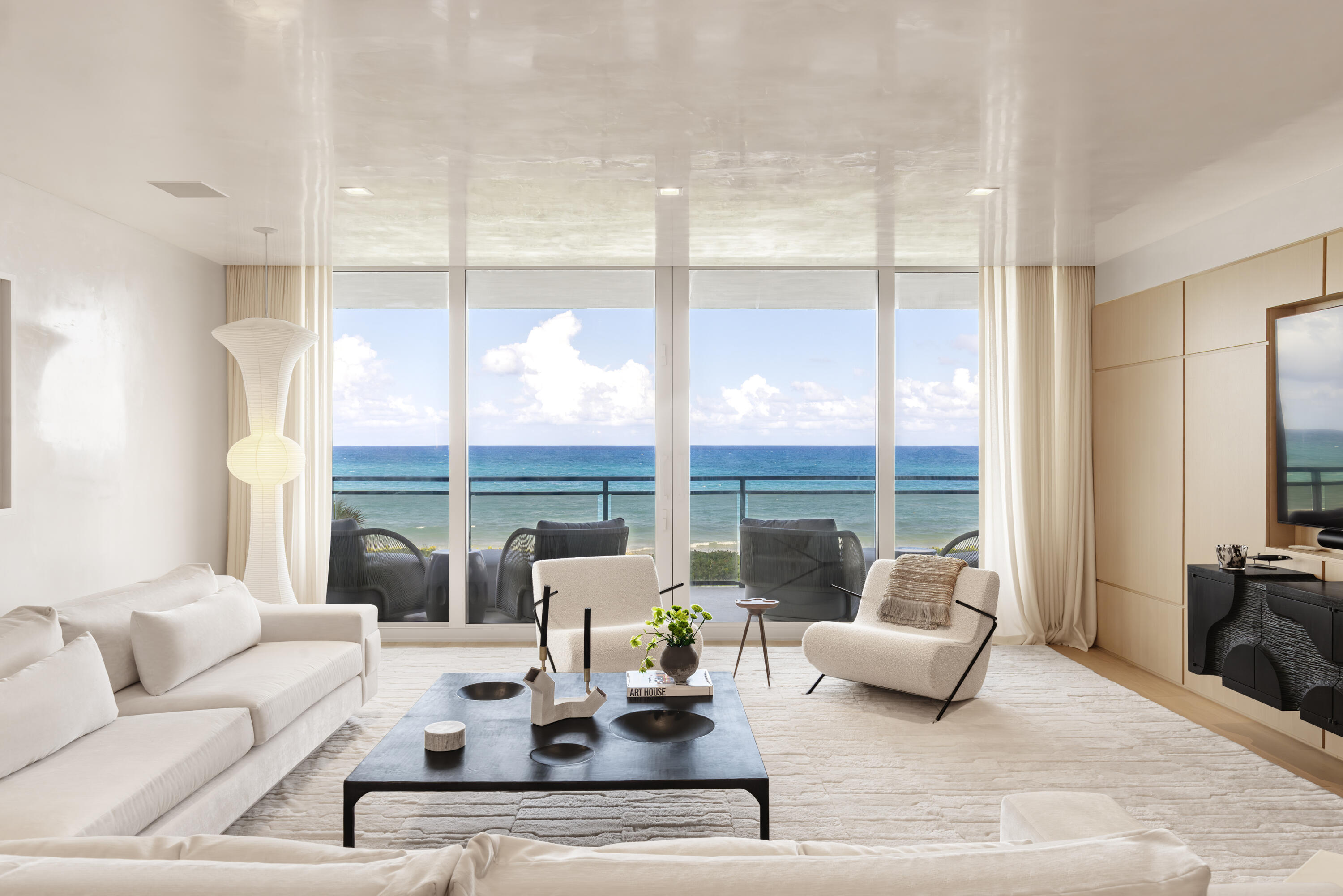 Introducing an exquisite Direct Oceanfront residence offering 3 spacious bedrooms with en-suite baths, powder room, and a beautifully appointed poolside cabana located in one of the most sought-after full service buildings. Walls of glass fill the interiors with natural light adding a seamless  connection to the surrounding ocean. A custom Boffi kitchen is equipped with Wolf and Subzero appliances and refined finishes throughout the breakfast room and gracious dining room. Volume ceilings, wide-plank white oak floors, hand troweled plaster walls and ceilings are complemented by bespoke millwork and exceptional detailing throughout. Residents enjoy resort-style living, 24/7 gatehouse, doorman, fitness center, expansive pool/spas, tennis, pickleball, 2-car assigned garage, and pet friendly!