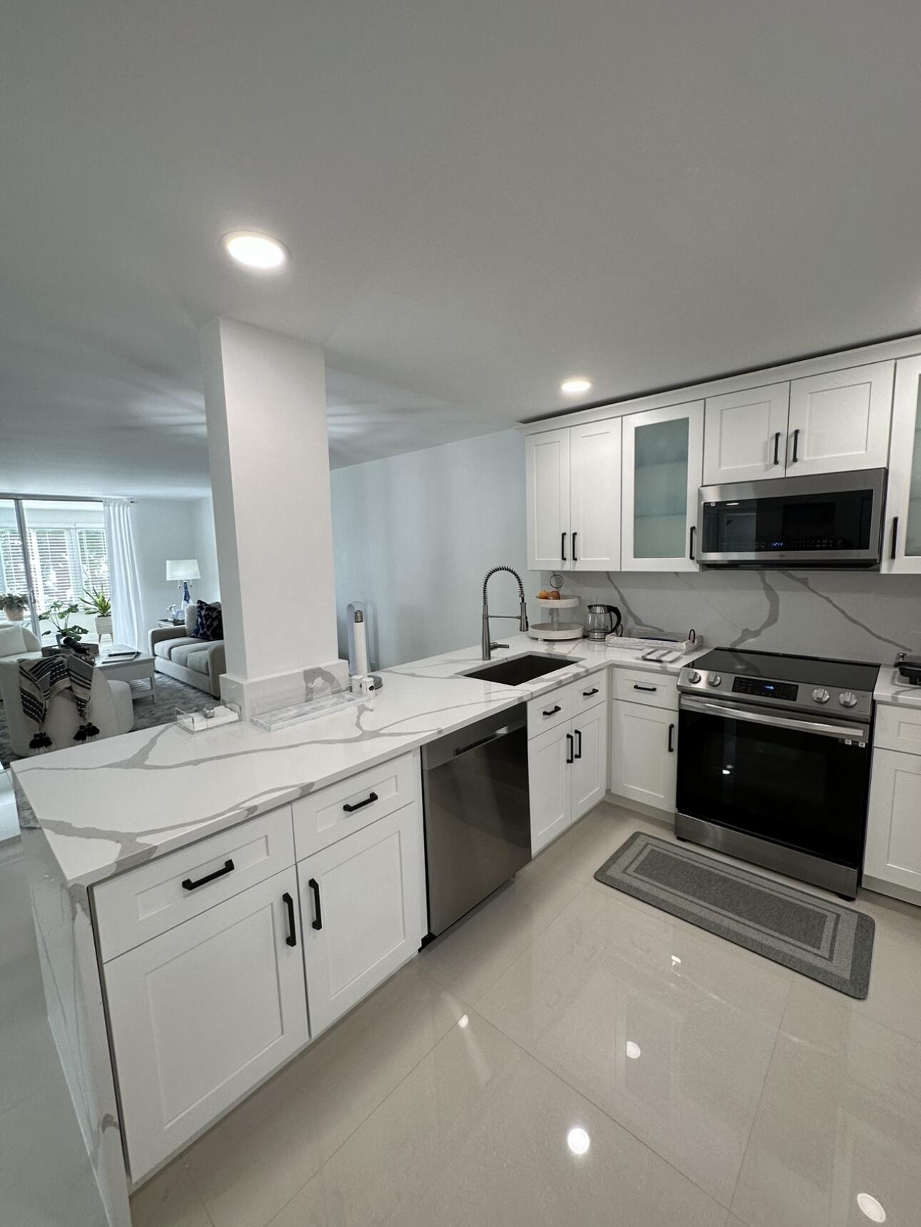 Welcome to this well-appointed two-bedroom, two-bathroom condominium located in the Villages of Oriole Deauville in Delray Beach, Florida. This residence offers 1,044 square feet of finished living space across four stories, providing efficient and thoughtfully designed accommodation. The two full bathrooms ensure convenience for residents and guests alike. Situated within the established Villages of Oriole Deauville community, this condo presents an accessible living option in a centrally located Delray Beach setting. This property represents a solid opportunity for those seeking a compact yet complete residential space. GREAT INVESTMENT OPPORTUNITY!!! FULLY LUXURY RENOVATED APARTMENT!! 10 MINUTES TO THE BEACH, NEAR ALL RESTAURANTS, SUPERMARKET, STORE