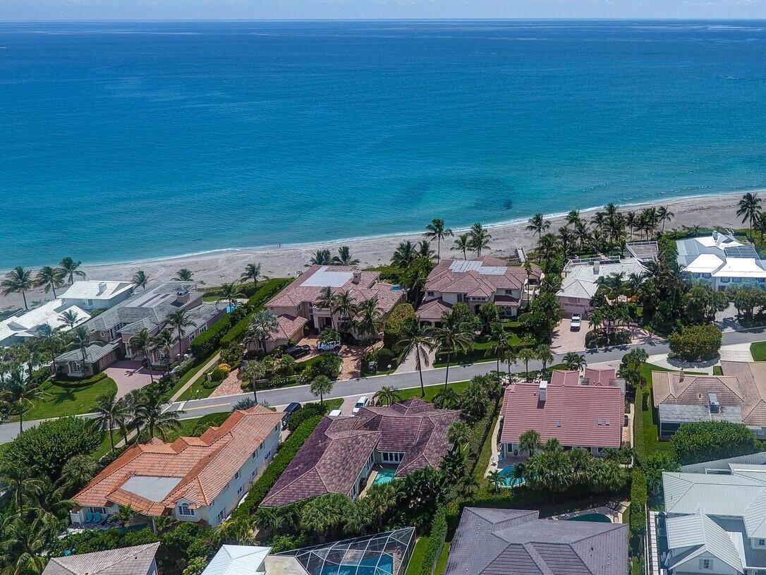 BIG PRICE REDUCTION!! This is your rare opportunity to own a single story home located on Ocean Drive in Jupiter Inlet Colony. This premier location is across from the access path to the turquoise Atlantic waters. This charming pool home features 3 spacious bedrooms, plus an office with custom cabinetry, 4 baths & 3,100 sq ft of living space. Volume ceilings throughout living areas, wood & tile floor & open floor plan. The spacious master suite features his & her bathrooms, large walk-in closet & pool access. Fresh & open kitchen with gas range, wine refrigerator, contemporary cabinetry, porcelain island & quartz countertops. Enjoy the ocean breeze from the adorable heated pool & patio area. Jupiter Inlet Colony is its own municipality on South Jupiter Island with it's own police force.