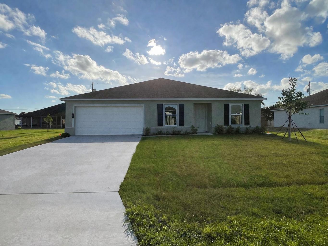 Beautifully built in 2024, this property offers 4 spacious bedrooms and 2 full bathrooms. The home features a 2-car garage and includes a valuable upgrade with an electric vehicle charging connection. Additionally, the property is equipped with a water filtration system for added convenience and quality. Ideally located near I-95 and the Turnpike, this home provides easy access to major highways. It is also close to shopping centers, schools, plazas, restaurants, and all essential amenities, making it perfect for comfortable family living while enjoying everything this beautiful home has to offer.