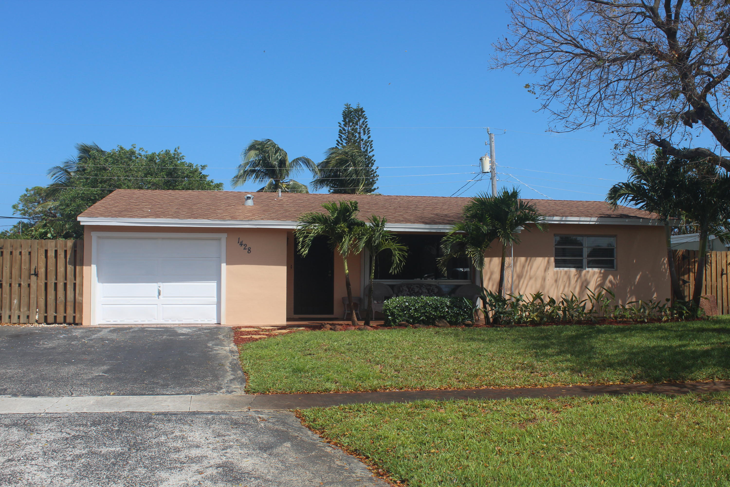 Lovely single family home located in prime East location close to shopping and the beach.  Large screened patio, air conditioned garage with dog door for access to dog run on the side of the property. Freshly painted and ready to move in immediately.   Large fenced yard.  Owner covers water, pest control monthly and lawn maintenance.