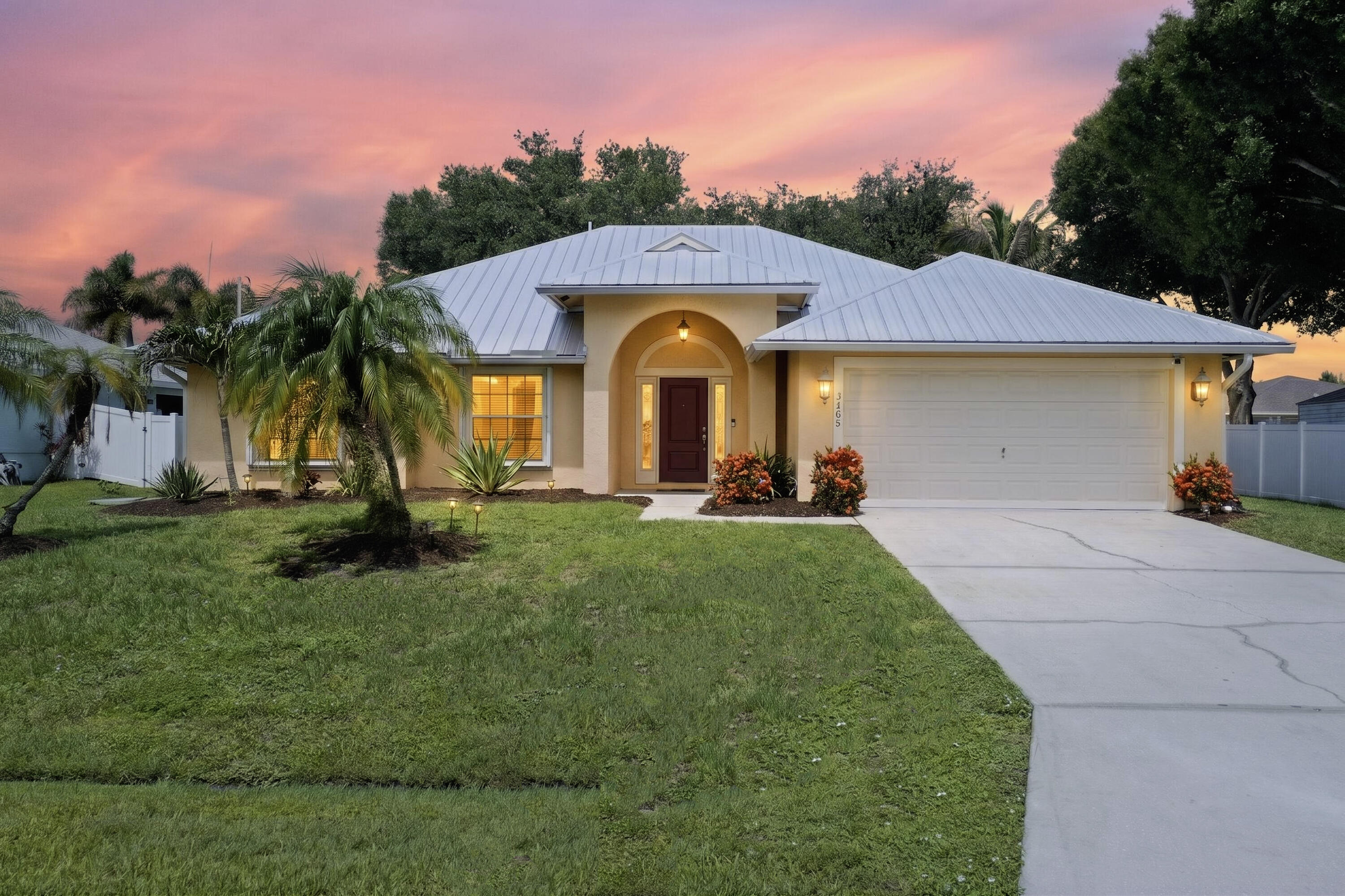 All of major capital improvements are completed in this home, where 2024 metal roof, 2023 AC, 2020 water heater, & 2021 accordion shutters  offer instant peace of mind! A formal dining & living area greets you at the entrance, leading directly to the heart of the home—a large open-concept kitchen & family room combo that makes everyday living & entertaining a breeze. A tastefully updated master ensuite awaits, featuring warm new flooring & a beautifully renovated master bathroom with a sleek seamless glass shower enclosure. Large sliders flood the home with natural light, creating a beautifully blended indoor & outdoor living space. 3 Large Bedroom for friends and family! Perfectly located in the heart of Port St. Lucie, near Gatlin area shopping, dining, I-95, & the Turnpike!