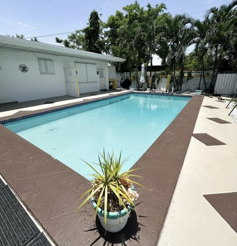 Poolside living in Hallandale Beach, just minutes from the beach. Fully renovated 2-bedroom, 1-bath unit in a duplex featuring a bright open-concept layout connecting the living room and kitchen with modern finishes and a clean, contemporary design throughout. Move-in ready with quality upgrades and low-maintenance living. Enjoy access to a pool in a quiet residential setting. Ideal for responsible long-term tenants seeking a well-maintained home in a peaceful environment. Conveniently located near beaches, shopping, dining, and major highways. Only this unit is being offered for rent.