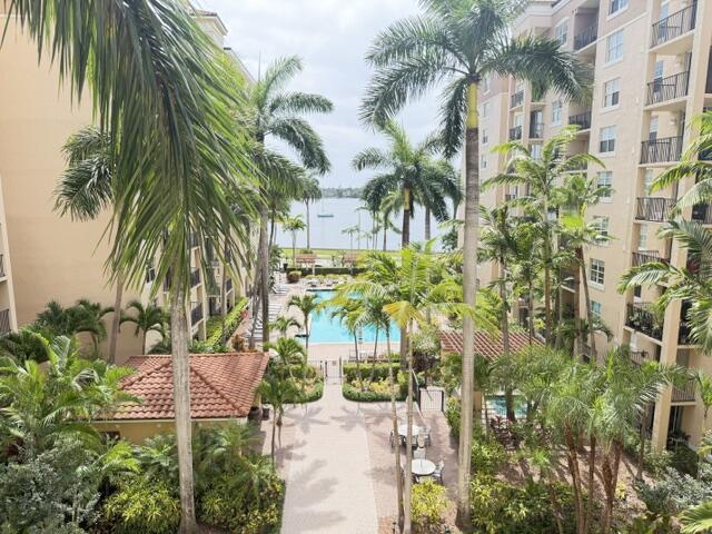 Welcome home to this waterfront condominium situated in Flagler Pointe, West Palm Beach, offering exceptional water views from every room and views of the pool deck and other amenities..  This two-bedroom, two-bathroom residence spans 1,071 square feet of thoughtfully designed space, providing comfort and functionality in a highly accessible location. Positioned on the 5th floor, the property is light aand bright with new carpet throughout and has two-car garage parking spaces. As a waterfront property, this condominium places you in proximity to the area's aquatic character and natural appeal. This West Palm Beach residence represents a compelling option for those seeking a well-appointed condominium with practical amenities and a prime location.