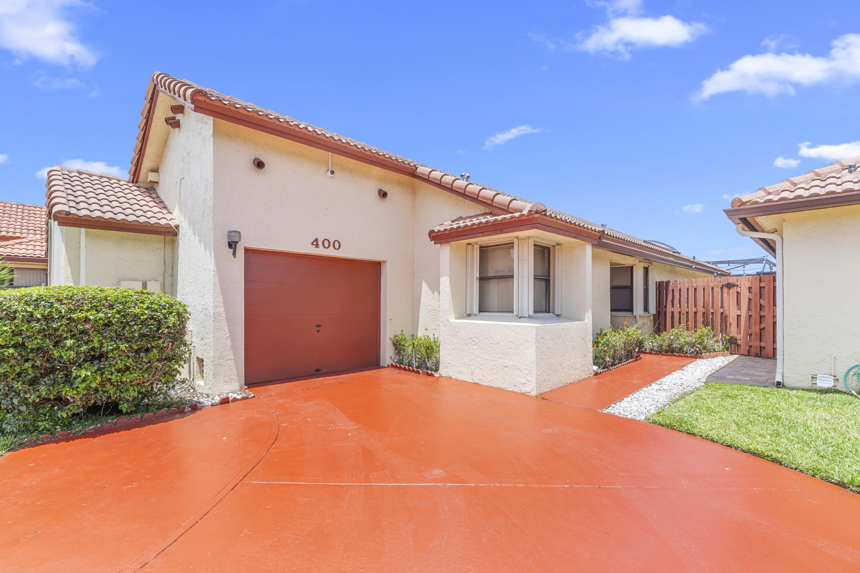 Swim in your own private pool and enjoy the serene lake views from your screened-in patio which overlooks a fully-fenced garden where your children or pets can play.  This 3-bed home with a 1-car garage is located in a highly-desirable area that has every shop and restaurant imaginable, plus super-easy access to the highway. Large eat-in kitchen with food pantry has tons of cabinet and counter-top space, and two of the bedrooms have walk-in closets. This Cartagena model has Cathedral ceilings, lots of windows and doors, and accordion shutters on all openings.  The homeowner association has extremely low fees and takes good care of the community which has a small park.  You won't find this square footage with a pool and view, in this location - and in this price point - anywhere nearby.