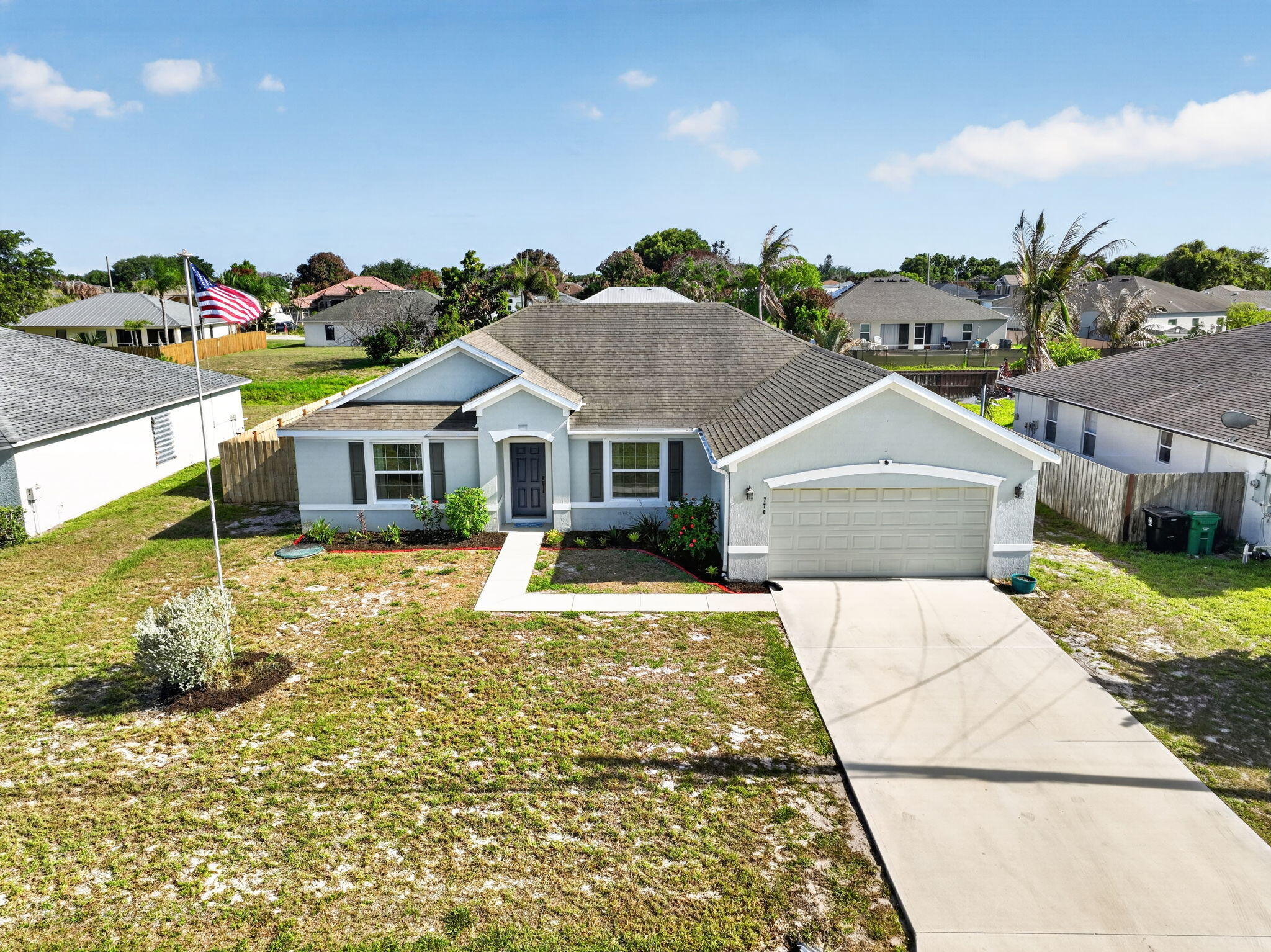 Welcome to this beautiful, maintained home in the heart of Port St. Lucie,, Florida. the perfect blend of comfort, style and functionality. Featuring an open concept layout filled with natural light, this home boasts generous living spaces and a modern kitchen ideal for entertaining, with newer appliances, and an extra fridge in the garage included..  Modern suite designed for comfort with a separate tub and double sink. Step outside to enjoy a large backyard with plenty of room for outdoor living, family gathering, or future additions. Conveniently located near schools,  shopping centers, parks, dining, and major highways. This move-in-ready home is a must-see.  Don't miss the opportunity to own a beautiful piece of Florida living. Come to 770 SW SARAGOSSA AVE. PORT ST LUCIE!!!
