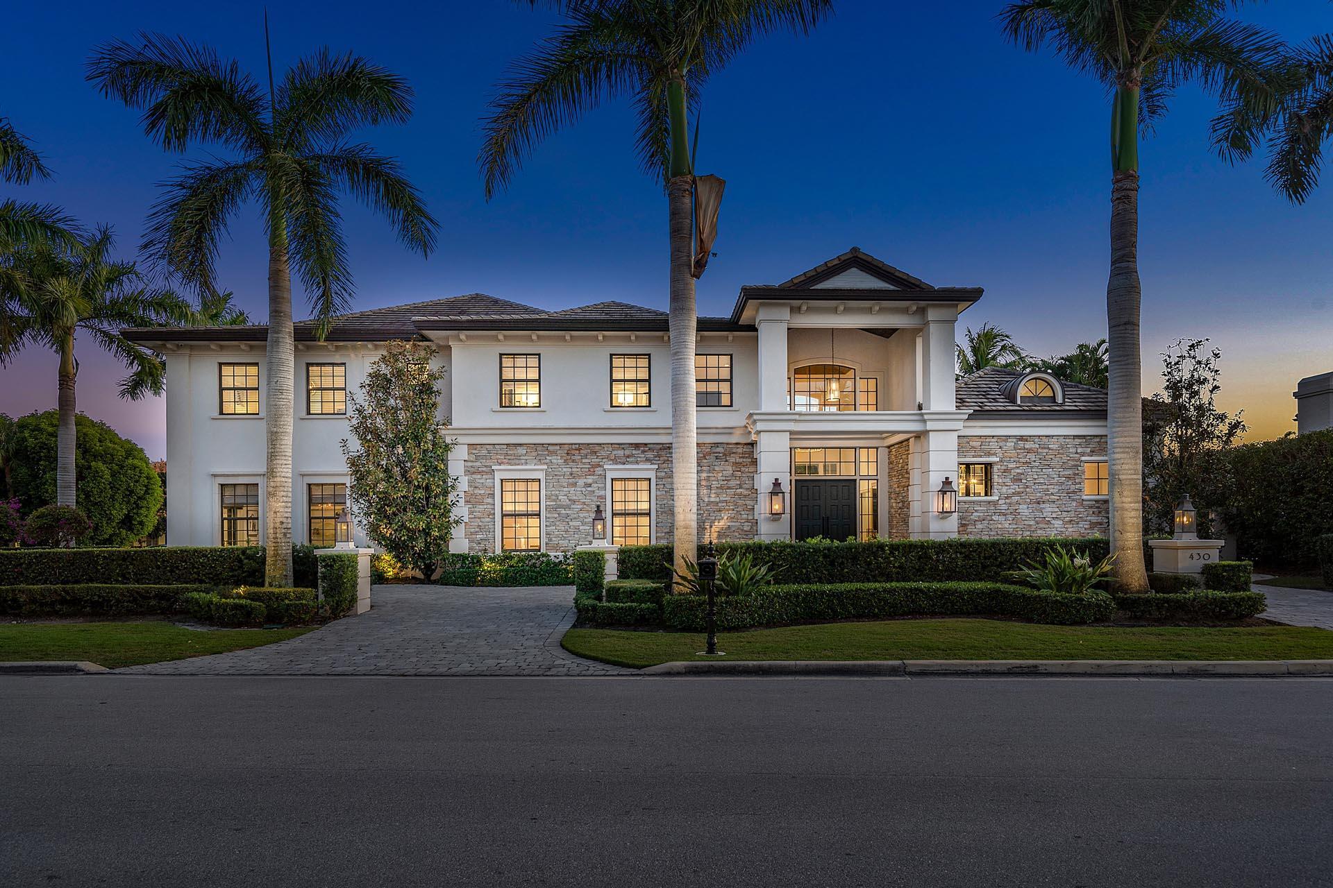 Welcome to 430 Royal Palm Way, an exceptional home situated on a prime corner lot in the highly coveted community of Royal Palm Yacht & Country Club. Built to exacting standards by Compson Homes, this stunning property boasts a grand two-story foyer entrance leading to a backyard oasis, complete with a bamboo privacy hedge, garden pergola, and inviting pool with fire pit peninsula!

This stylish home offers five spacious bedrooms, each with its distinct character and a den, providing ample room for all your needs. The interior boasts beautiful walnut flooring, creating an ambiance of warmth and luxury. The open-concept kitchen flows seamlessly into the family room and breakfast area, and a convenient side entrance leads directly into the laundry/mudroom area, perfect for daily living. In addition, the 3-car garage plus golf cart storage is located on the side of the home, allowing plenty of parking for guests in the circular driveway.

The second-floor master suite is truly a retreat, with His & Her bathrooms, a wet bar, and a private balcony overlooking the stunning backyard. Added features are the fully integrated Crestron smart-home system and natural gas generator.