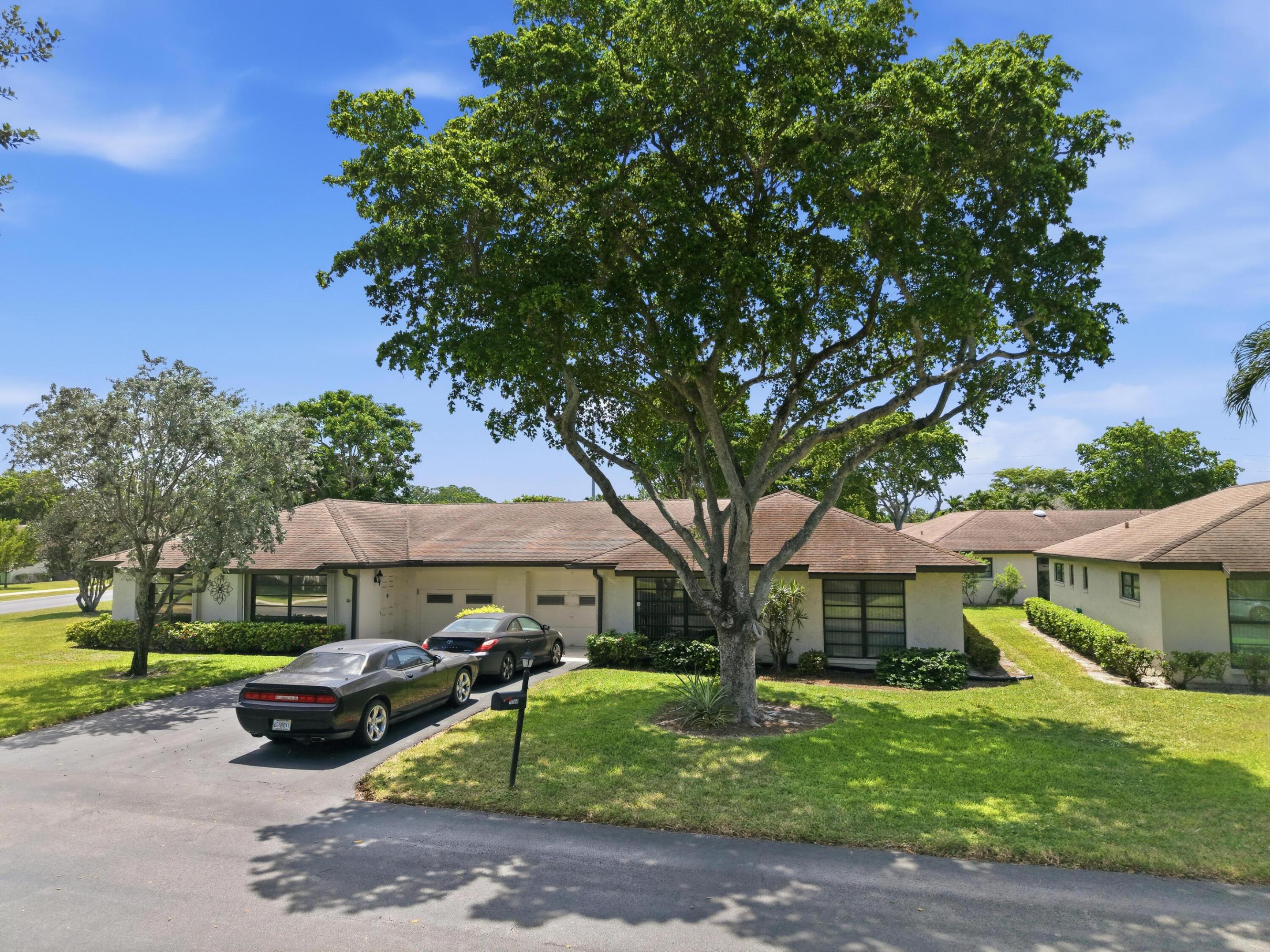Welcome home to this beautifully updated, move-in ready villa in the highly desirable 55+ community of Greentree Villas. Meticulously maintained and showing true pride of ownership, this residence offers an inviting, open layout with tasteful upgrades throughout. The updated interior blends comfort and style, creating a bright, welcoming space that's ready for its next owner from day one. Enjoy spacious living areas, an updated kitchen and baths, generous bedrooms, and a private outdoor patio perfect for relaxing or entertaining. Conveniently located near shopping, dining, golf, and everything South Florida has to offer, this exceptional home is the perfect combination of quality, comfort, and carefree living. A true must-see!