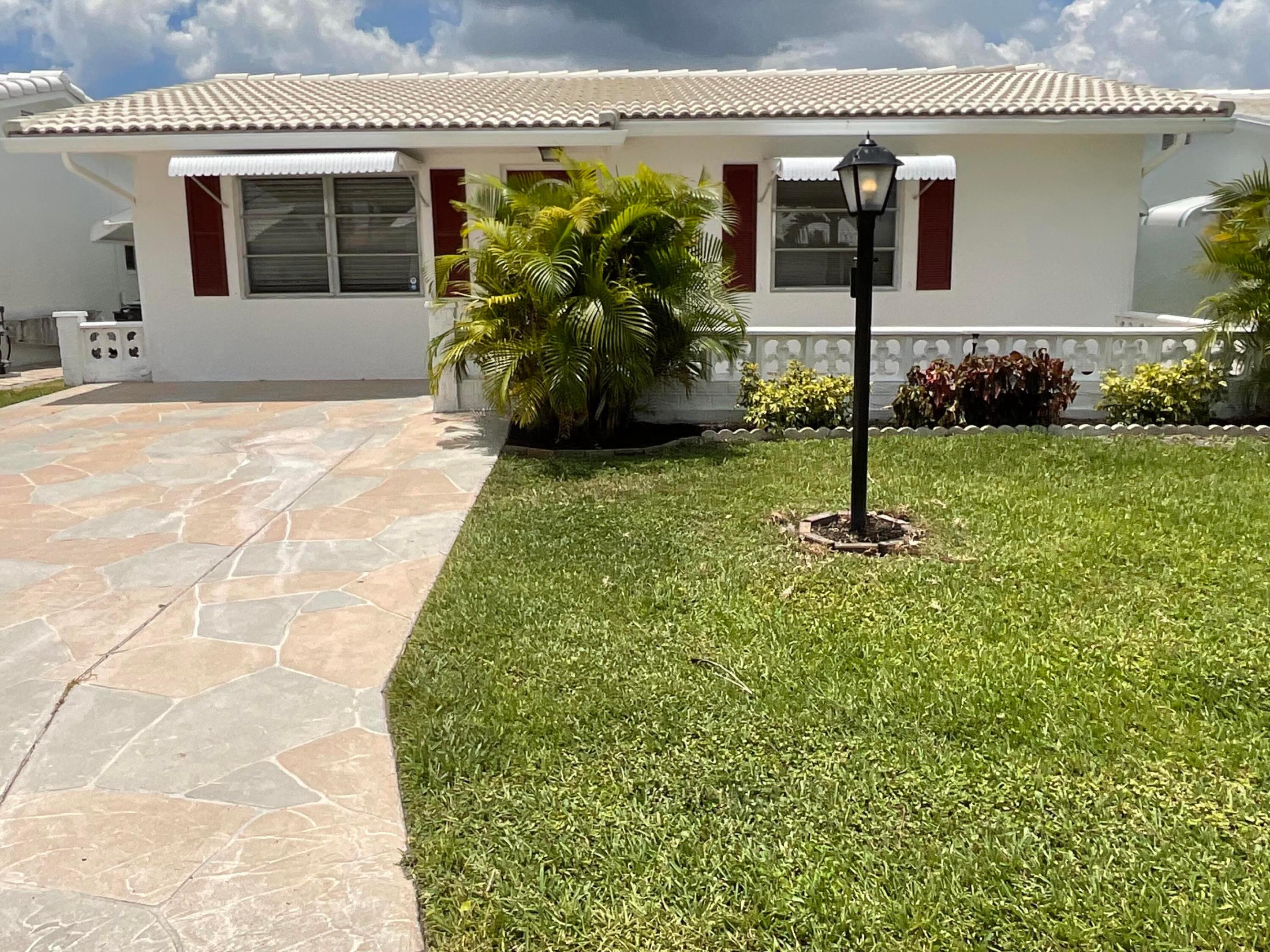 Welcome to this charming 3-bedroom, 2-bathroom single-story house with new airconditioner and newer 2019 barrel tile roof located in an Active senior community. Boynton Beach Leisureville , Florida. This well-designed home offers 1,224 square feet of finished living space, providing comfortable accommodations across one convenient level. Two huge bedroom of the three 2 baths, Eat in kitchen, rear patio and grass space . Upgrades are newer stainless steel appliances, newer water heater. Fabulous active living with clubhouse for your daily activities. Located about a mile to the Boynton Beach, and other fine water restaurants on the intracoastal where you can navigate your boat.  community clubhouse with heated pool, fitness, tennis, activities,