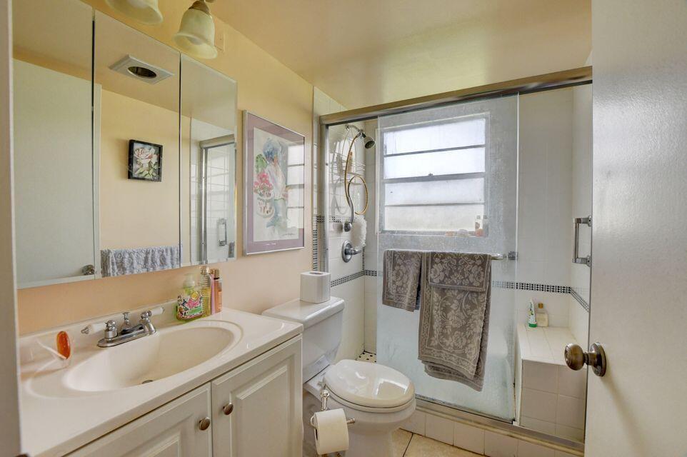 Beautiful first floor corner unit filled  with lots of natural light and a serene lake view. This condo offers updated laminate flooring, updated kitchen with modern cabinetry, and a shower stall. Be part of this active 55 plus community.