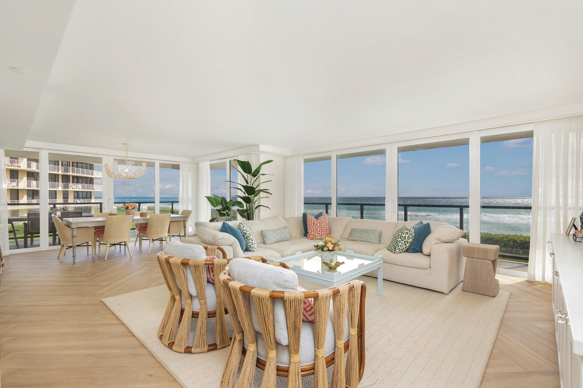 Experience a rare opportunity to own a direct oceanfront residence at The Halcyon in Palm Beach. This beautifully reimagined three-bedroom, three-bath home offers 2,226 square feet of refined interior living space, complemented by an expansive 760-square-foot covered wraparound terrace—perfect for effortless indoor-outdoor living and entertaining. Every room is designed to capture breathtaking, unobstructed ocean views, enhanced by walls of floor-to-ceiling impact glass that flood the home with natural light. With coveted due east exposure, wake each morning to spectacular sunrises over the Atlantic Ocean. Completely renovated by C Studio, the residence features the finest finishes throughout, including Waterworks fixtures, elegant Schumacher wallpaper in the foyer, and Thibaut wall  coverings in the primary and guest bathrooms. Rich herringbone floors add warmth and timeless sophistication. Residents of The Halcyon enjoy exceptional amenities, including direct beach access with chaises and umbrellas, Har-Tru tennis courts, a pool and barbecue area, community room and fitness center. Turnkey and move-in ready, this exceptional home offers a seamless blend of luxury, comfort, and design—capturing the very best of the Palm Beach lifestyle.