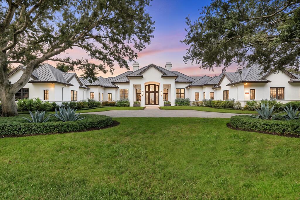A private sanctuary in Palm Beach Gardens, 13001 Brynwood captures the very essence of refined living. Tucked within the gates of Old Marsh Golf Club, this singular estate offers more than 9,200 square feet of interior living across a lush 1.3-acre parcel, embraced by sweeping preserve and water vistas. With 5 bedrooms, 8 bathrooms, and a layout designed for both quiet family life and grand-scale entertaining, every space feels intentional, timeless, and elevated.
Inside, the home is defined by custom finishes, natural stone, intricate millwork, and walls of glass that draw in light and frame the views. The
centerpiece of the home is a 1,200 sq ft chef's kitchen, seamlessly connected to both formal and informal living areas. Additional highlights include a game room with bar, a library paneled in rich wood, a state-of-the-art fitness studio, and a collection of flexible retreats for work, rest, or play. The primary suite is a retreat unto itself. Arriving through a private vestibule, you'll discover dual boutique-style dressing rooms that frame the entrance, each leading into its own spa-inspired bathroomdesigned to offer both connection and personal privacy. The suite also incorporates a hidden hurricane safe room. Beyond the interior, a vanishing-edge pool, an expansive covered loggia with fully appointed outdoor kitchen and bar, all overlooking miles of preserve. Total privacy, total escape. Life at Old Marsh is rare by design. With just 180 homes, the community is anchored by one of the nation's most respected Pete Dye championship courses. The club operates without tee times, celebrated for its caddie program, and is deeply committed to preserving the integrity of the game and the land. Old Marsh is a Certified Audubon Cooperative Sanctuary, reflecting its dedication to environmental stewardship and harmony with native habitat. Often called a "purist club," for those who value the tradition, purity, and
natural beauty of golf. Just minutes from the finest shopping, dining,
cultural venues, and the Atlantic coastline, this home offers both
sanctuary and accessa rare combination in the Palm Beaches.