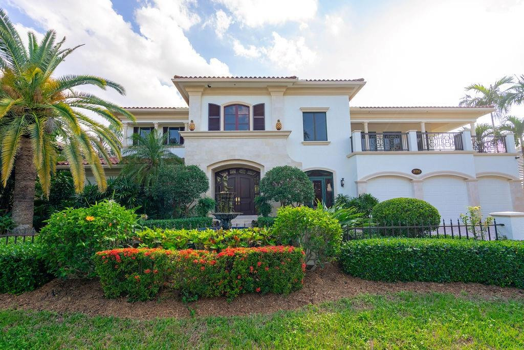 Timeless British West Indies masterpiece featuring 4 bedrooms plus bonus and exercise room, and 5.5 baths. Ideally located just 5 minutes to the ocean on the canals offering the greatest water depth in the city. Desirable South exposure. All-concrete construction, including concrete between floors, and elevated on pilings. First-floor primary suite allows for easy living. Three-car garage plus tackle room/workshop. Secondary kitchen and laundry combo adjacent to the main kitchen makes entertaining effortless. Expansive wraparound balcony overlooks a lush tropical backyard with covered patio, pool and integrated spa, and 100’ of dockage on Ipe wood dock. Original seawall replaced with a king batter pile seawall. A truly rare deepwater opportunity.