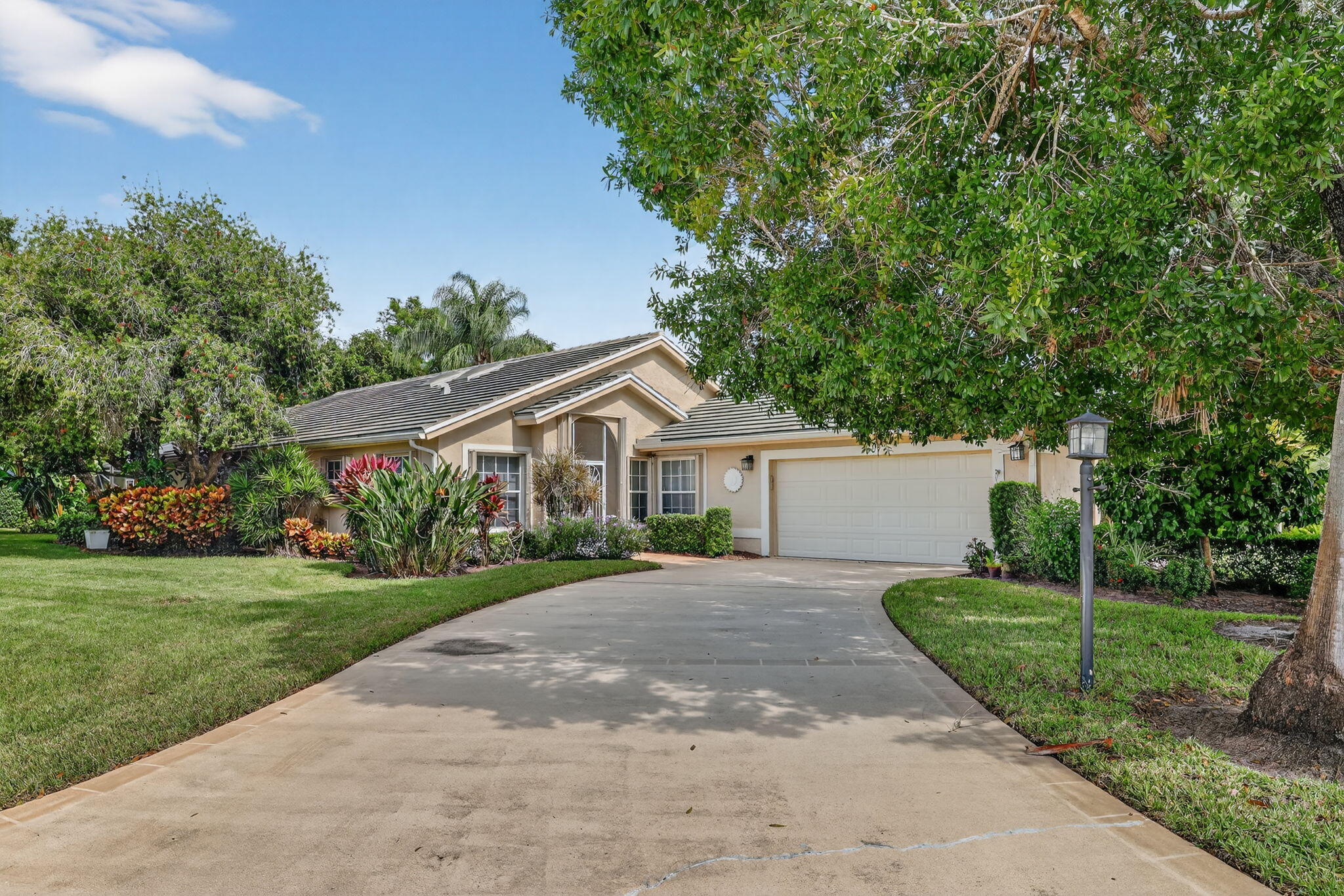 Welcome to Marsh Landings at PGA Village! This 3-bedroom, 3-bath pool home with a 2-car garage is ideally located on a quiet cul-de-sac within the golf community of PGA Village. 

The home offers a spacious split floor plan filled with natural light, providing comfortable living spaces for everyday life.
The master bathroom has been recently renovated and features dual sinks and modern finishes. Enjoy the Florida lifestyle with a screened pool and covered patio area, perfect for relaxing or entertaining guests. The main living areas feature ceramic tile flooring, while all bedrooms have carpet for comfort.

Residents enjoy access to resort-style amenities, including large pool a fitness center, banquet room, tennis and pickleball courts, playground, and optional golf and social membership.