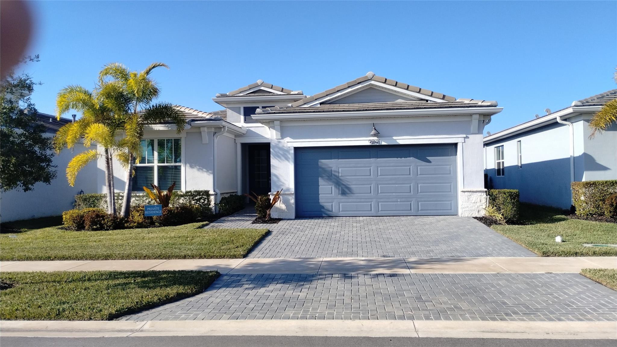 Pristine Sage model, never occupied residence in a gated 55+ community.  Offers 2 bedrooms plus a flex room with French doors ideal for office or den, 2 full baths, tile flooring thruout. Dedicated laundry room with washer/dryer, 2 car garage, patio and an extended, covered lanai. $36K in structural options plus $60K in design upgrades.  75" TV included. All Window coverings, Motorized shades on rear sliders.Experience the ultimate in luxury resort living with our expansive 20,000 sf clubhouse.  This stunning venue offers both indoor and outdoor spaces for every occasion.  Resort-style pool, stay active in the state-of-the-art exercise studio, Pickle Ball and Tennis. Explore your culinary creativity in the demonstration kitchen, or tap into your artistic side in the inspiring art studio.