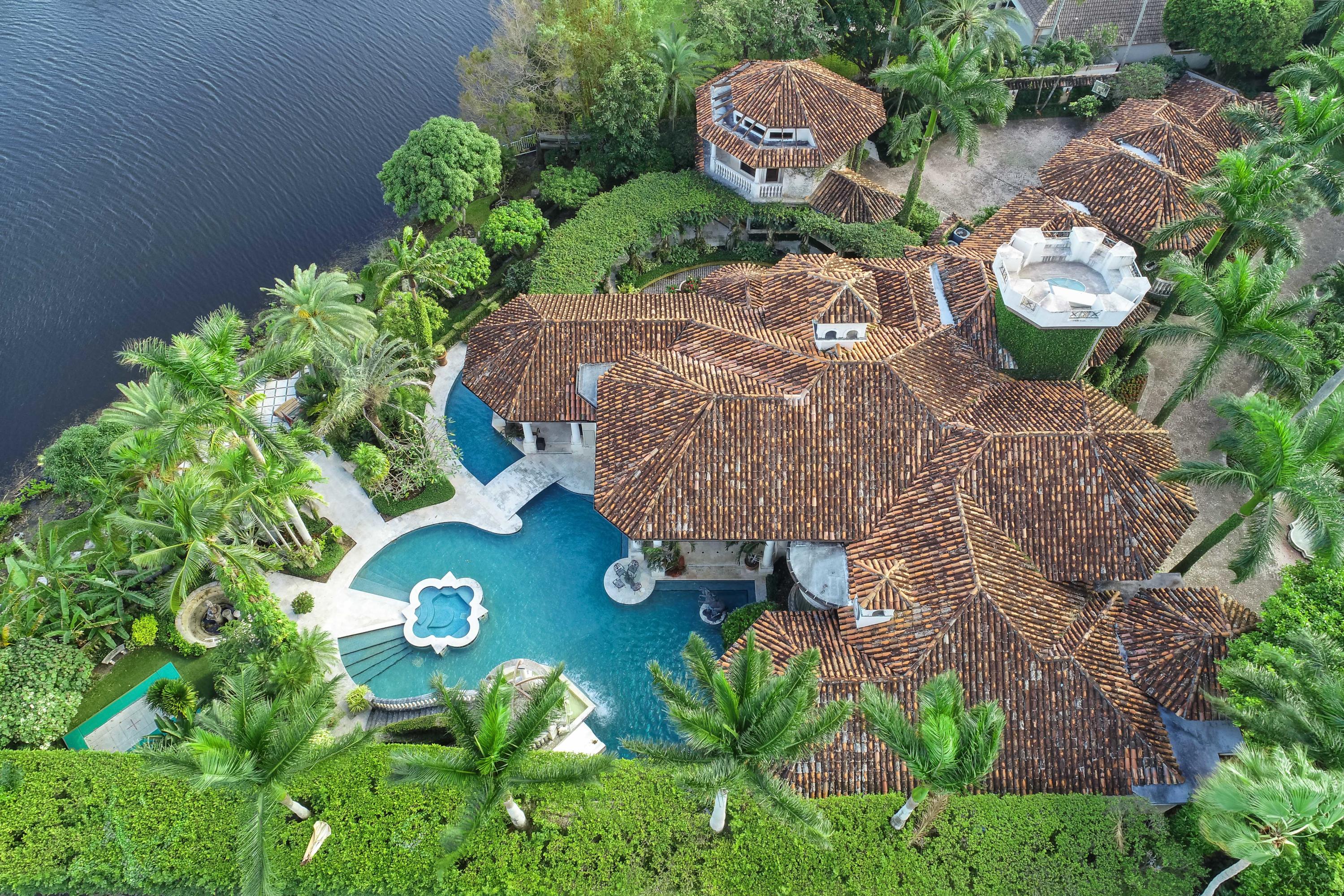 A GREAT ESTATE ON A DOUBLE HOMESITE IN FRENCHMAN'S CREEK. THE MEDITERRANEAN-STYLE ARCHITECTURE AND AMAZING SETTING OF THIS HOME IN THE EXCLUSIVE, GATED COMMUNITY OF FRENCHMAN'S CREEK MAKE THIS ONE OF THE PREMIER LIFESTYLE HOMES IN ALL OF SOUTH FLORIDA. Truly a world-class estate because of the home's old European detail in design combined with state-of-the-art technology employing the latest in energy efficiency, audio-video entertainment, security, and modern gourmet kitchen. This fabulous home is 13,383 total square feet and rests on a gracious double home site looking over wide lakes and Frenchman's Creek's spectacular south golf course. A GREAT ESTATE ON A DOUBLE HOMESITE IN FRENCHMAN'S CREEK. THE MEDITERRANEAN-STYLE ARCHITECTURE AND AMAZING SETTING OF THIS HOME IN THE EXCLUSIVE, GATED COMMUNITY OF FRENCHMAN'S CREEK MAKE THIS ONE OF THE PREMIER LIFESTYLE HOMES IN ALL OF SOUTH FLORIDA. Truly a world-class estate because of the home's old European detail in design combined with state-of-the-art technology employing the latest in energy efficiency, audio-video entertainment, security, and modern gourmet kitchen. This fabulous home is 13,383 total square feet and rests on a gracious double home site looking over wide lakes and Frenchman's Creek's spectacular south golf course. Enter through the stately 14-foot double doors to magnificent 24-foot ceilings with coquina stone floors with granite insets, hip vaulted ceilings, and wood-burning fireplace. Besides the luxurious master suite there are four separate guest suites and two extra suites in the guest home. Frenchman's Creek has 720 pristine acres just off the Intracoastal Waterway. This established country club offers every amenity including concierge services, 17 Har-Tru tennis courts, two 18-hole championship golf courses, a world class fitness center and spa with a professional year-round staff. The real gem is the private beach club which is a true five-star operation. The 72,000 square foot clubhouse completes the ultimate package for a luxurious Florida lifestyle.