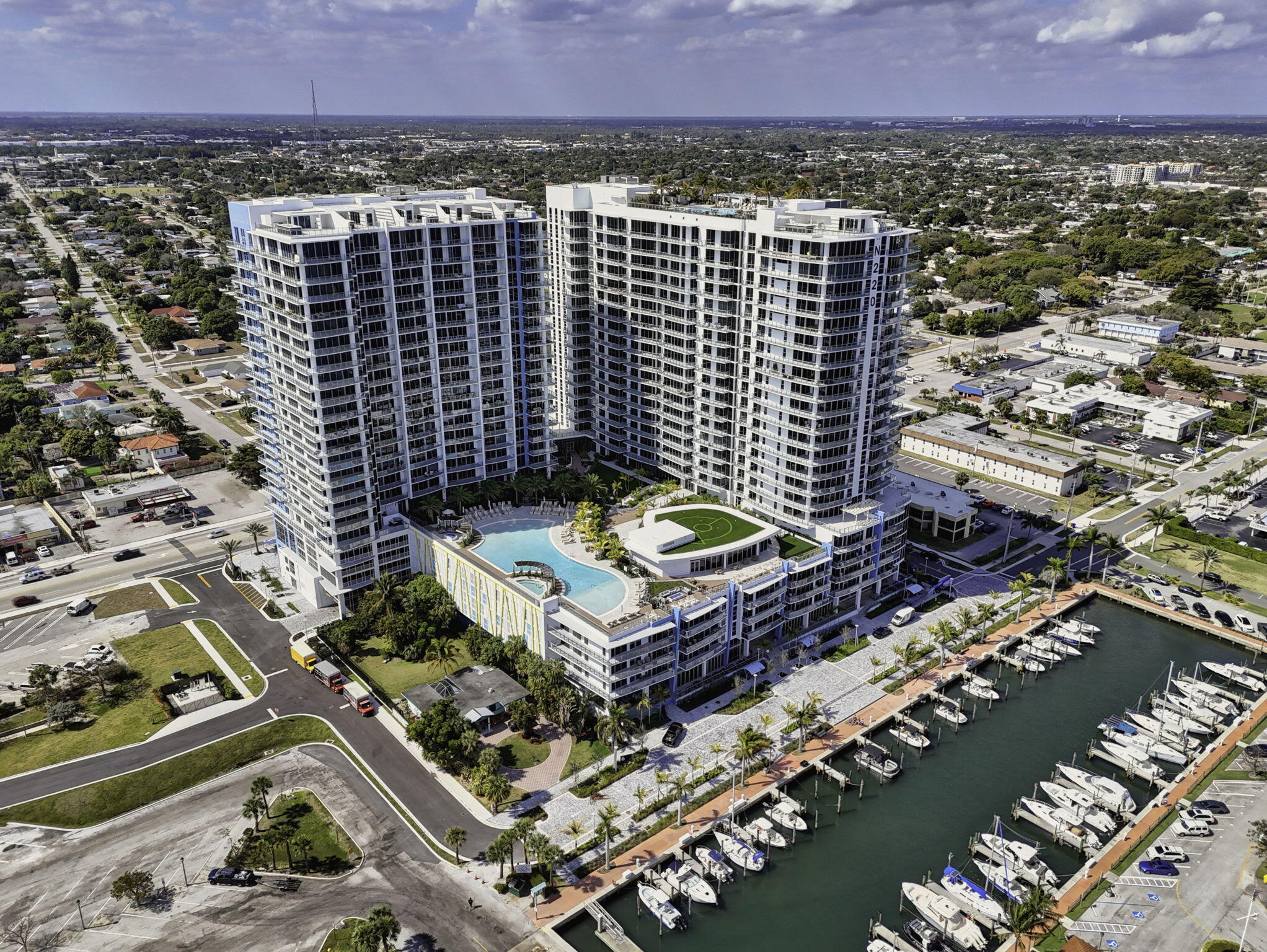 Welcome to Nautilus 220, where brand-new waterfront luxury meets elevated coastal living. Elegantly curated with the finest finishes and designer details, the owner spared no expense in creating this stunning fully furnished turnkey residence, designed for the ultimate in comfort, sophistication, and effortless living. Perfectly positioned on the coveted 6th-floor wing, this exceptional 2-bedroom plus den, 2.5-bath condominium offers over 1,700 square feet of beautifully appointed living space. Dramatic 12.5-foot ceilings - among the highest in the building—create an extraordinary sense of volume, light, and architectural distinction. Expansive floor-to-ceiling impact glass fills the interiors with abundant natural light while seamlessly blending indoor elegance with picturesque  skyline and city views. This thoughtfully designed floor plan showcases contemporary lighting and designer fixtures, stunning luxury vinyl plank flooring, a private den with a custom built-in desk and integrated lighting, and an elegant powder room adorned with sophisticated designer wall coverings. The chef-inspired kitchen is a true showpiece, featuring sleek Quartz countertops, under-cabinet lighting, premium Miele appliances, and refined modern finishes—perfectly suited for both everyday living and effortless entertaining. Smart-home ready with customizable technology, latest Samsung Frame TV's and remote floor to ceiling blackout shades, this residence seamlessly blends convenience with sophisticated design. Retreat to the expansive primary suite, complete with a generous sitting area, custom-fitted walk-in closets with built-in lighting, and direct access to your private terrace. This tranquil outdoor space provides the perfect setting for morning coffee, evening cocktails, or simply relaxing while taking in the peaceful city skyline. What truly sets this residence apart is its coveted 6th-floor location, featuring beautifully appointed hallways with upscale designer finishes and flooring, while placing you just steps from Nautilus 220's exceptional collection of resort-style amenities. Residents enjoy an extraordinary array of indoor and outdoor amenities designed to rival the finest luxury resorts, including a spectacular resort-style pool and spa, private cabanas, yoga lawn, summer kitchen and pavilion, gazebo lounge with fire pit, and putting green. The expansive wellness plaza offers a state-of-the-art fitness center, dedicated spin studio, yoga rooms, steam rooms, and sauna, creating a private sanctuary for health and relaxation. Nautilus 220 delivers a truly elevated, full-service lifestyle, complete with concierge services, valet and secure garage parking, a grand attended lobby, and 24-hour security. Residents also enjoy exclusive access to acclaimed waterfront dining by renowned celebrity chef David Burke at SeaHawk Prime, along with an impressive collection of entertainment amenities, including a golf and sports simulator, private bowling lounge with bar, rooftop infinity pool and spa, and a stunning observation deck showcasing panoramic views of the marina, Intracoastal Waterway, and Atlantic Ocean. Offering an unparalleled blend of luxury, convenience, and waterfront sophistication, this MOVE-IN READY condo embodies the very best of coastal living at Nautilus 220.
