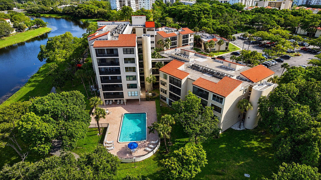 This spacious 2-bedroom, 2-bath residence offers peaceful lake and garden views from a private screened balcony and an excellent opportunity to make it your own. While the unit could benefit from some updating, it presents exceptional value. The seller may consider a concession with an acceptable offer, and the current assessment will be paid in full by the seller at closing. Cypress Bend features landscaped grounds with walking paths, heated pools, a clubhouse, fitness center, tennis and pickleball courts, sauna, and BBQ/picnic areas. Ideally located minutes from I-95, the Florida Turnpike, Whole Foods, Publix, Topgolf, Pompano Beach's award-winning beaches, Harrah's Pompano, and The Pomp entertainment district with exciting new dining, shopping, and future development.