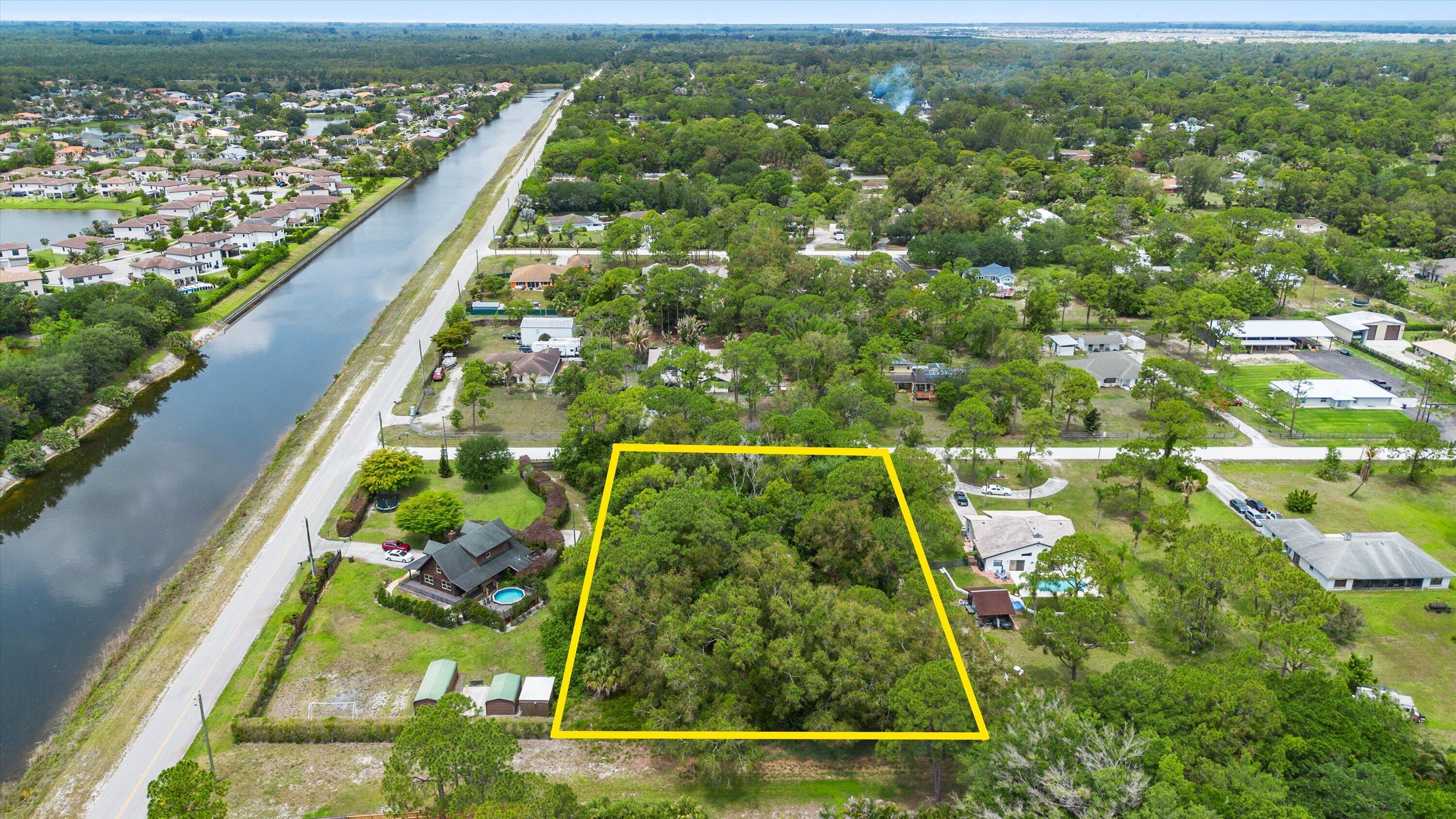If you've been dreaming about a little more space, privacy, and freedom, this 1.25-acre lot in The Acreage might be exactly what you've been waiting for. Tucked away among mature trees and natural surroundings, this property offers the opportunity to create something that truly feels like your own. Picture a custom home with room for your RV, boat, workshop, animals, or simply a backyard big enough to finally breathe a little. No HOA, no zero lot lines, and no feeling packed on top of your neighbors. Survey, elevation certificate, title insurance, and preliminary soil exploration already completed and available in the documents section. Sellers are open to assisting with clearing the lot depending on the buyer's vision. If you've been thinking about buying dirt... this might be your sign.