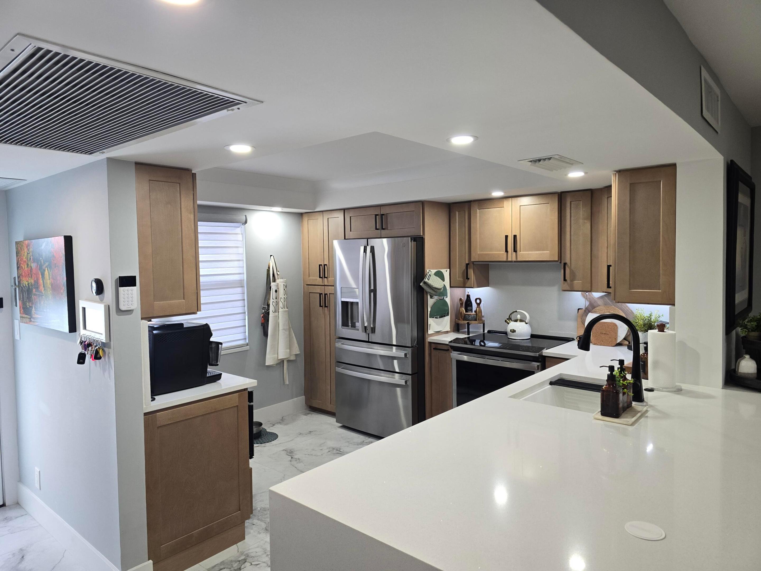 Fully Furnished | Smart Home | Fully Renovated | Min. 4-Month Lease | Wynmoor Country Club - Escape to South Florida this season in this stunning, fully renovated smart home condo, ideally located in the prestigious 55+ Wynmoor Country Club community! Inside the Unit: Smart home technology throughout for effortless, modern living. Fully renovated with appliances only 2 years old Full-size stackable washer & dryer — true in-unit convenience. Smart toilets for a true spa-like, upgraded experience. Floor-to-ceiling hurricane glass on the patio, plus impact windows throughout for peace of mind and unobstructed natural light. Tastefully furnished with curated art and decor — simply bring your suitcase. Move-in ready, turnkey comfort from day one. Wynmoor offers unmatched, resort-style living.