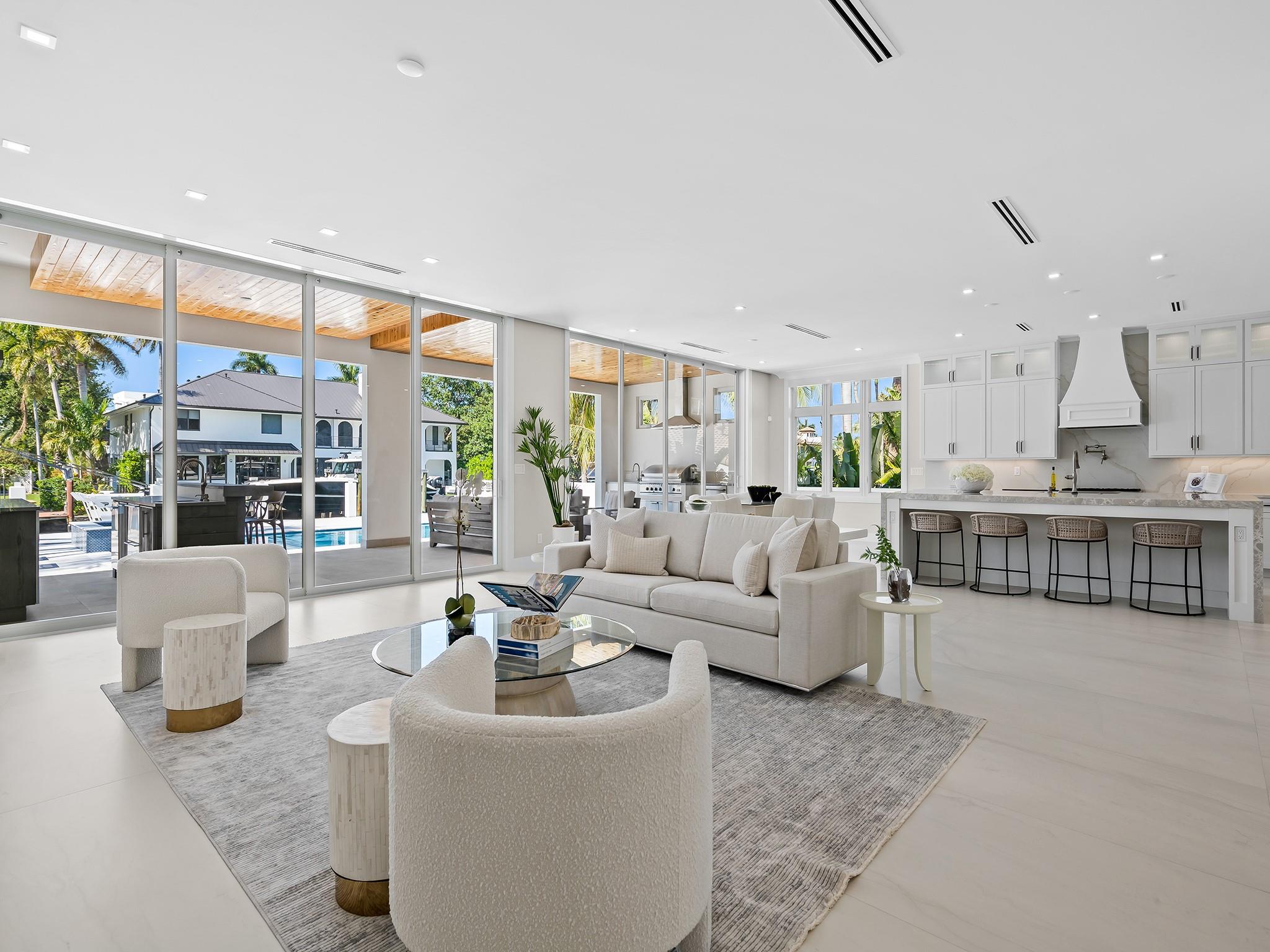 Every home has one opportunity to be sold as brand new, and now is your chance to be one of the few who can enjoy the luxury of owning a brand-new construction deepwater estate in the heart of Fort Lauderdale. You would, of course, want a great location, steps to everything, yet feeling like a million miles away when you're home. Beauty and craftsmanship in every visible detail, and a 60' dock for a large boat with no bridges. Lastly, you'd want a design that makes the most of indoor/outdoor living. The home you've been dreaming of is ready. Everything you could desire, including exceptional quality and luxurious finishes, features top-tier building materials, elevators, natural gas, and flawless craftsmanship: quick ocean access, just half a mile from Lauderdale beach and Las Olas dining.